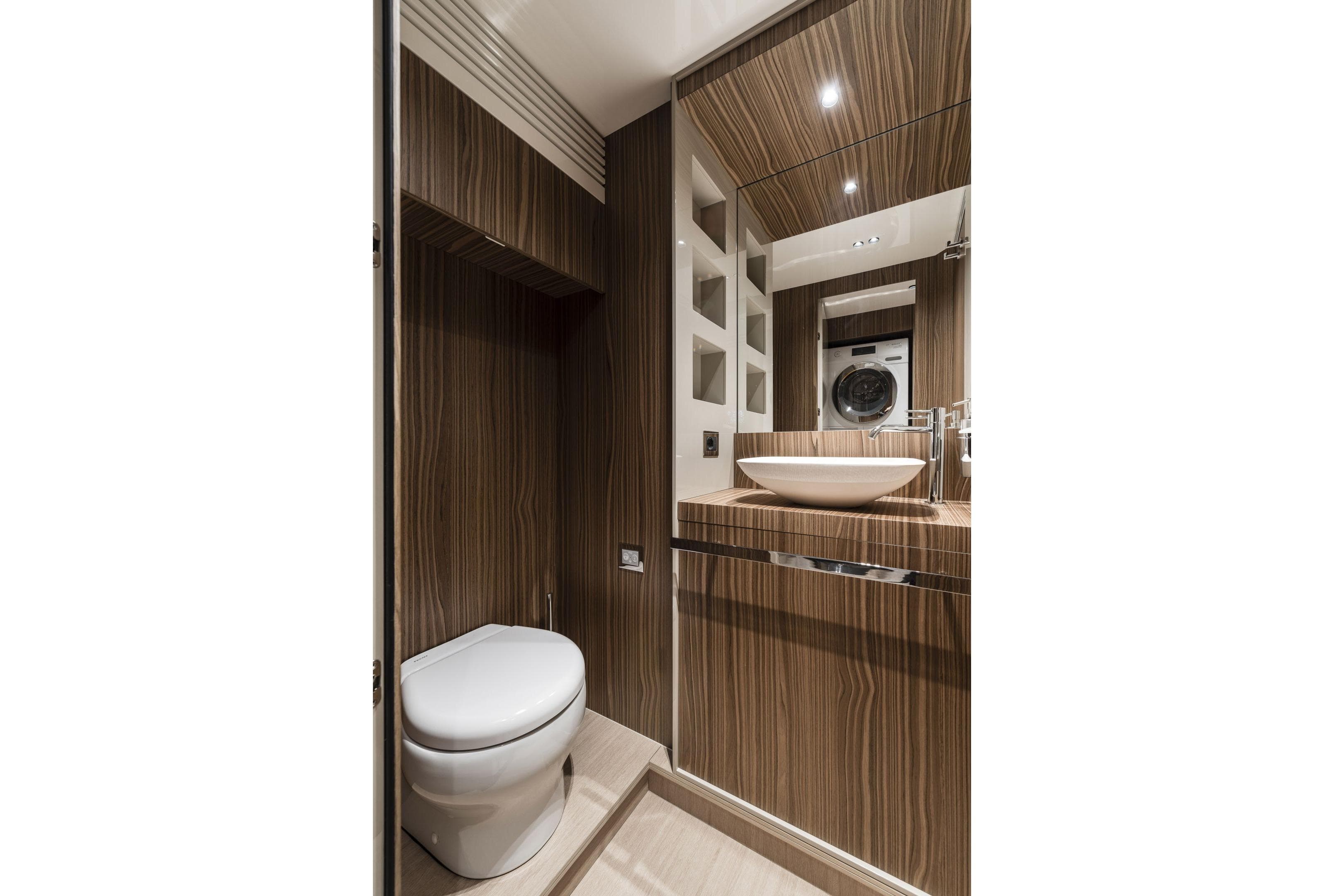 Luxurious bathroom in 2026 Cranchi Settantotto 78 yacht with modern wood finish.
