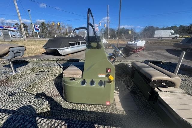 2026 Vexus ACX 2000 boat interior with camouflage design and seating.