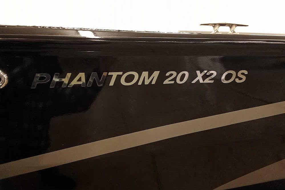 2026 Smoker Craft Phantom 20 X2 Offshore boat nameplate on black surface.