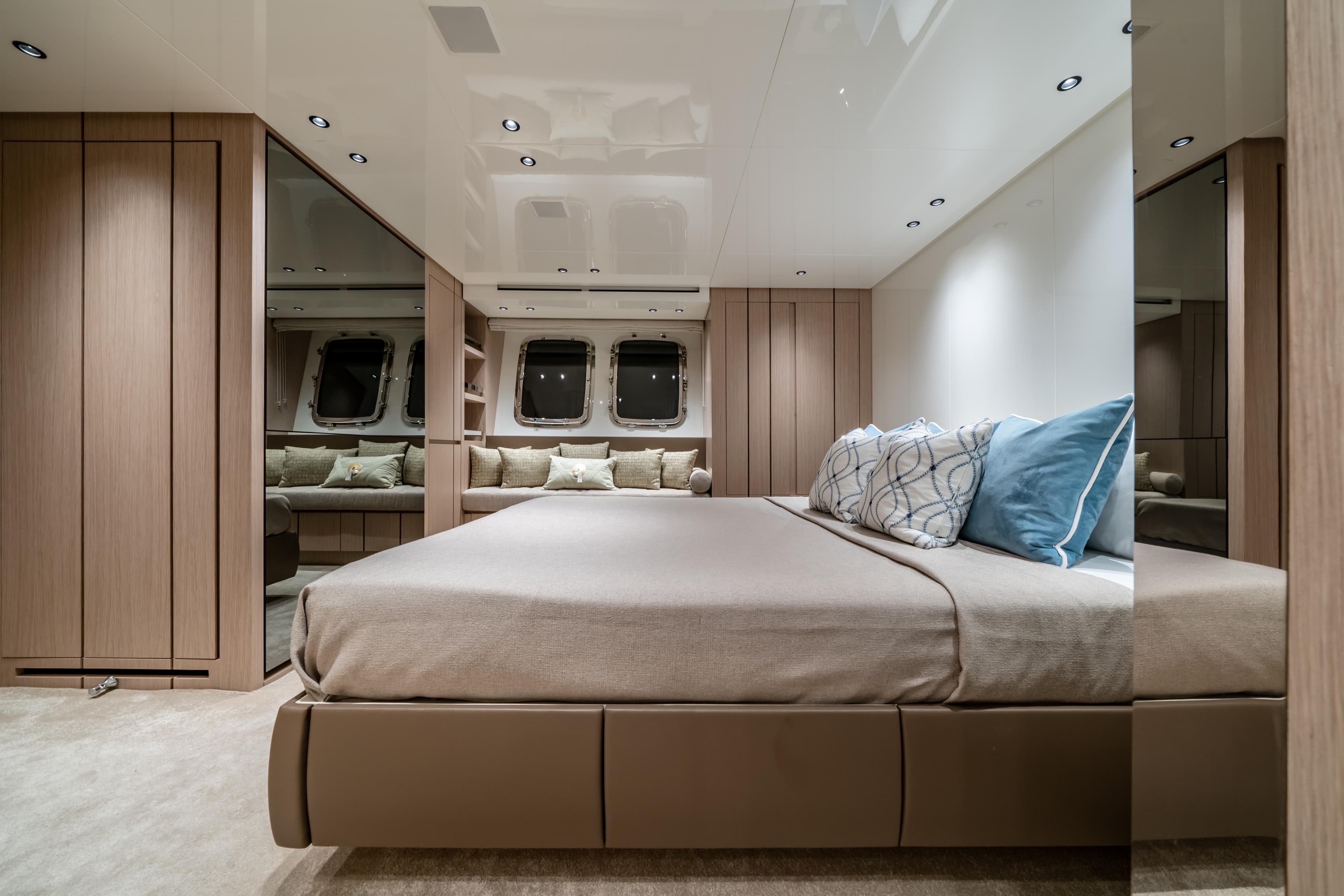 Luxurious Sanlorenzo SX76 2021 yacht bedroom with modern design and elegant furnishings.
