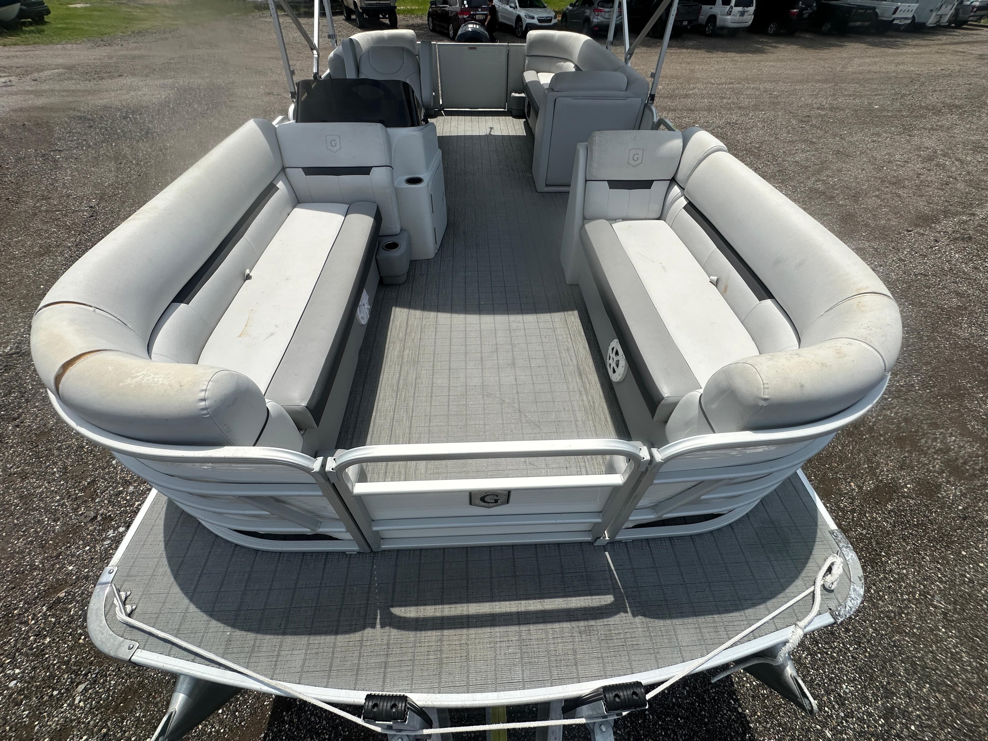 2021 Godfrey SWEETWATER 2186 SB pontoon boat with spacious seating and gray flooring.