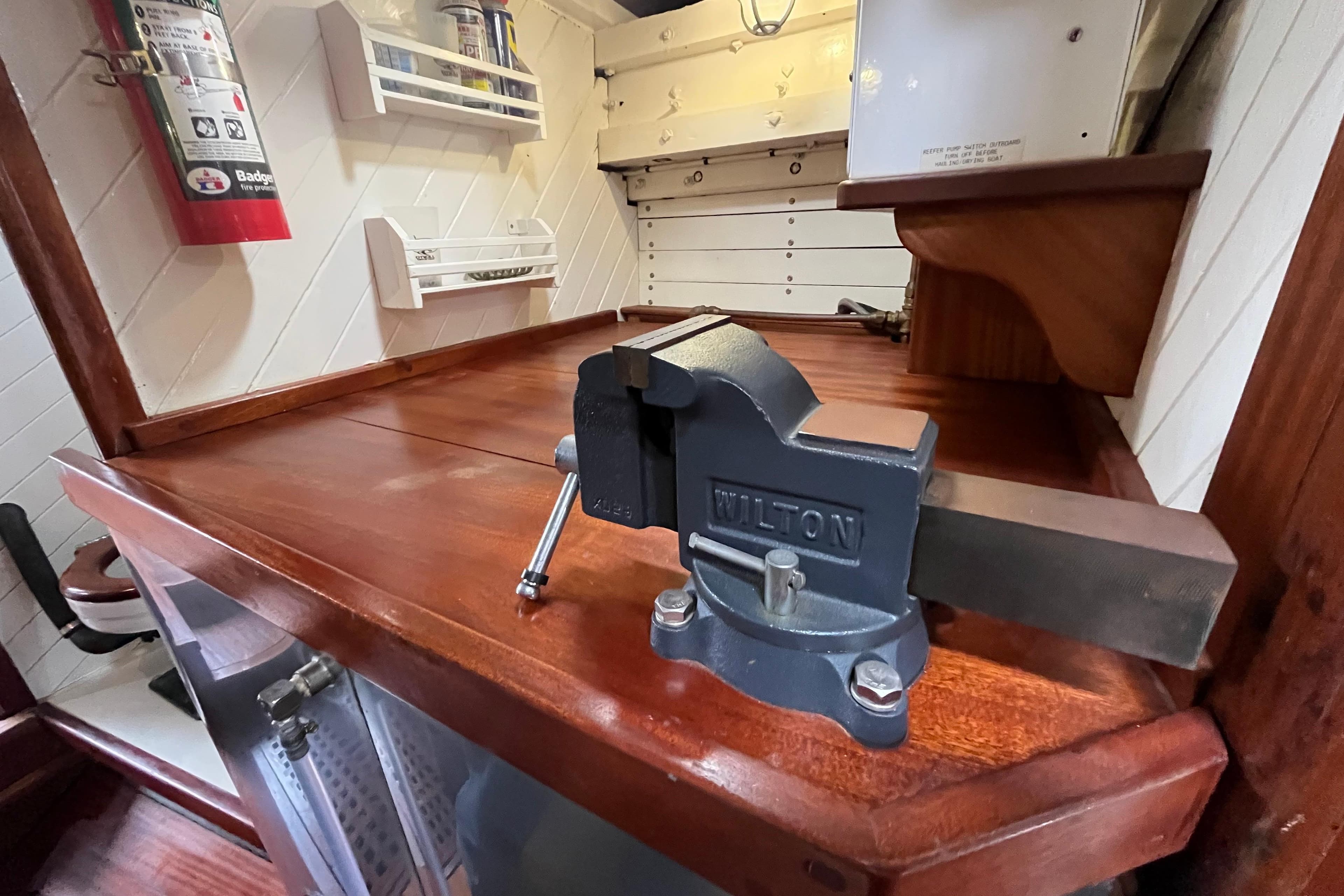 Wooden workbench with a Wilton vise on a 1947 Murray Peterson Schooner.