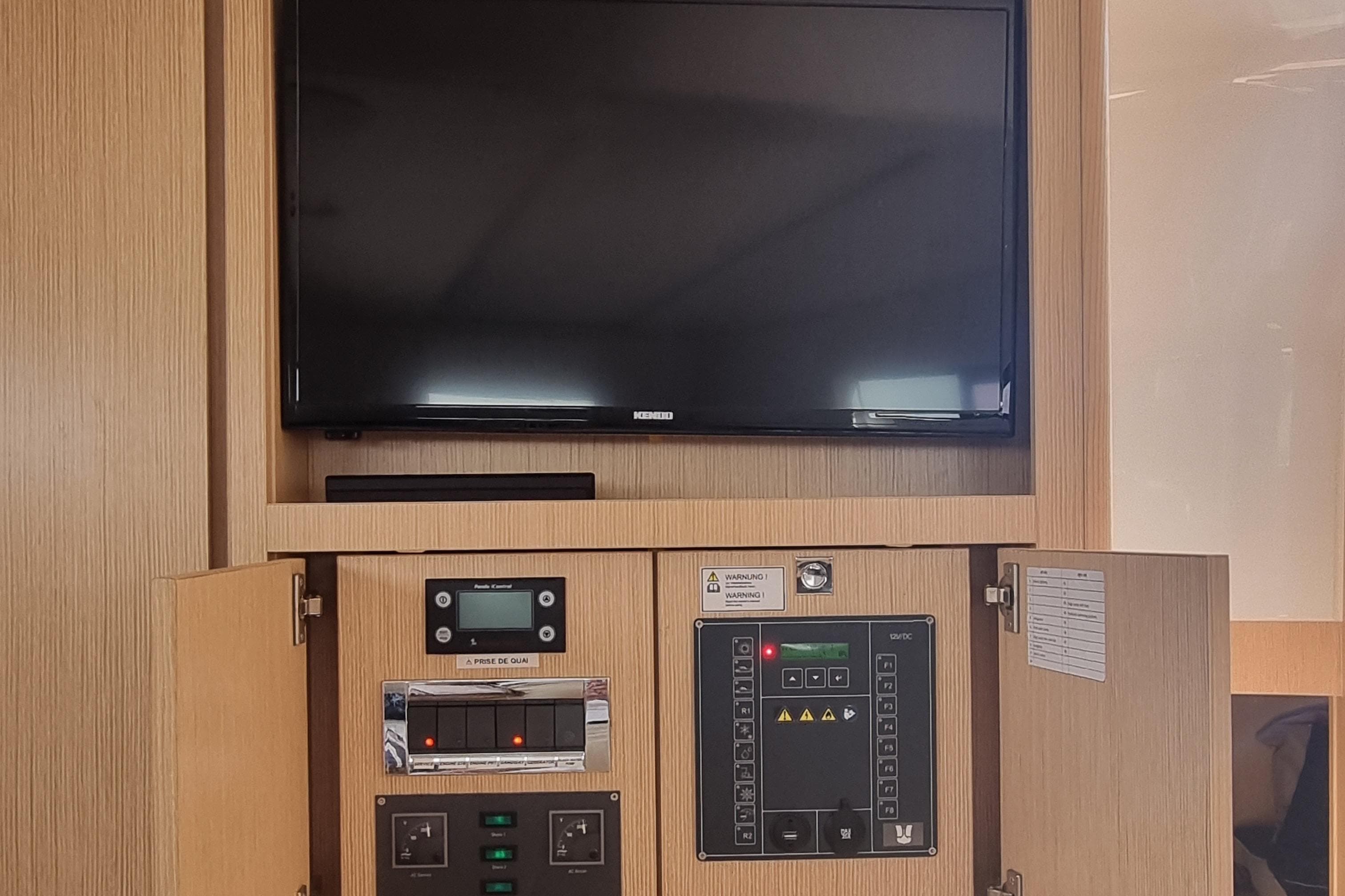 Control panel and TV setup inside a 2019 Fjord 44 Open yacht.