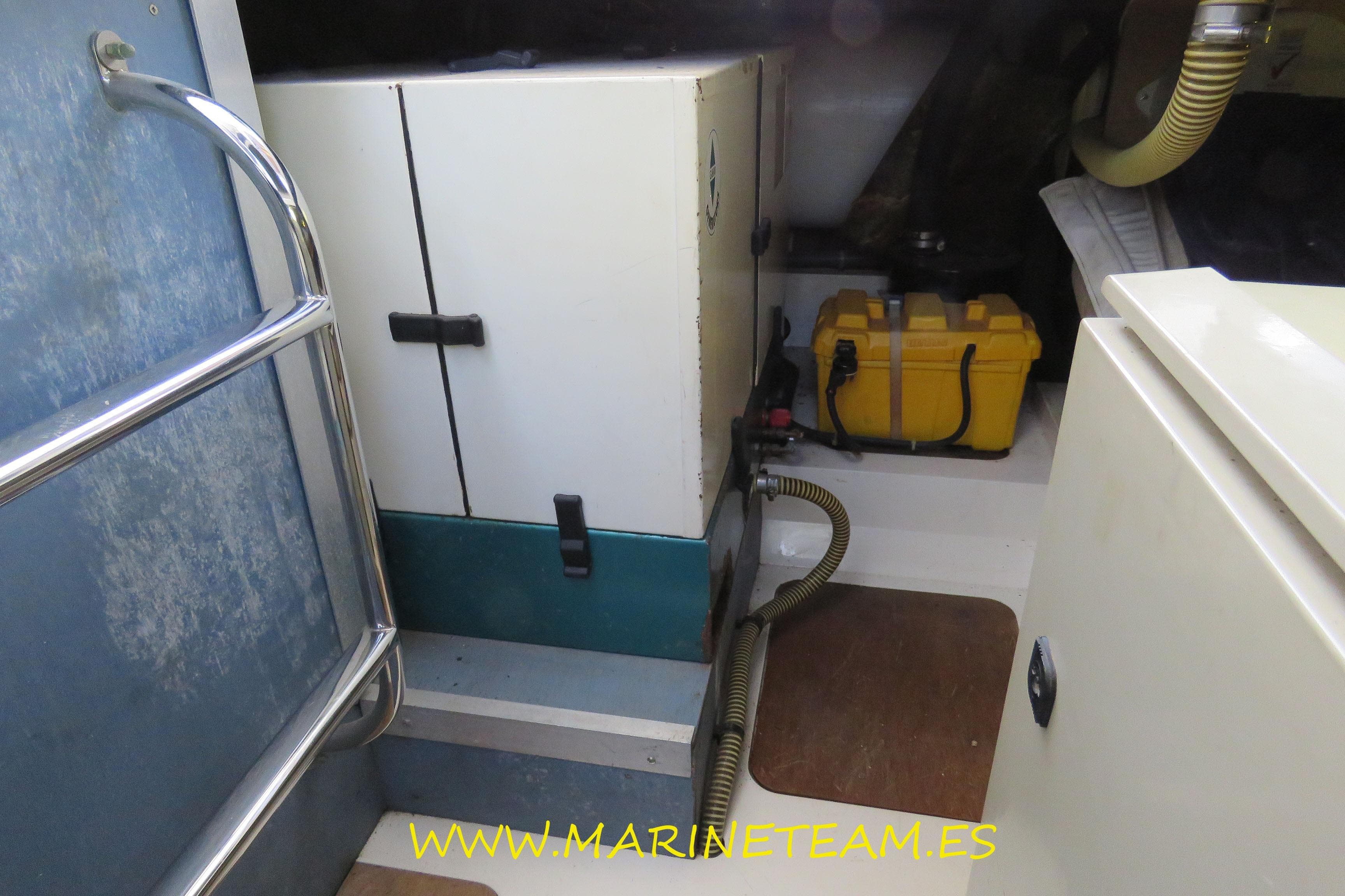 Engine room of a 1995 Princess 60 yacht with equipment and storage.