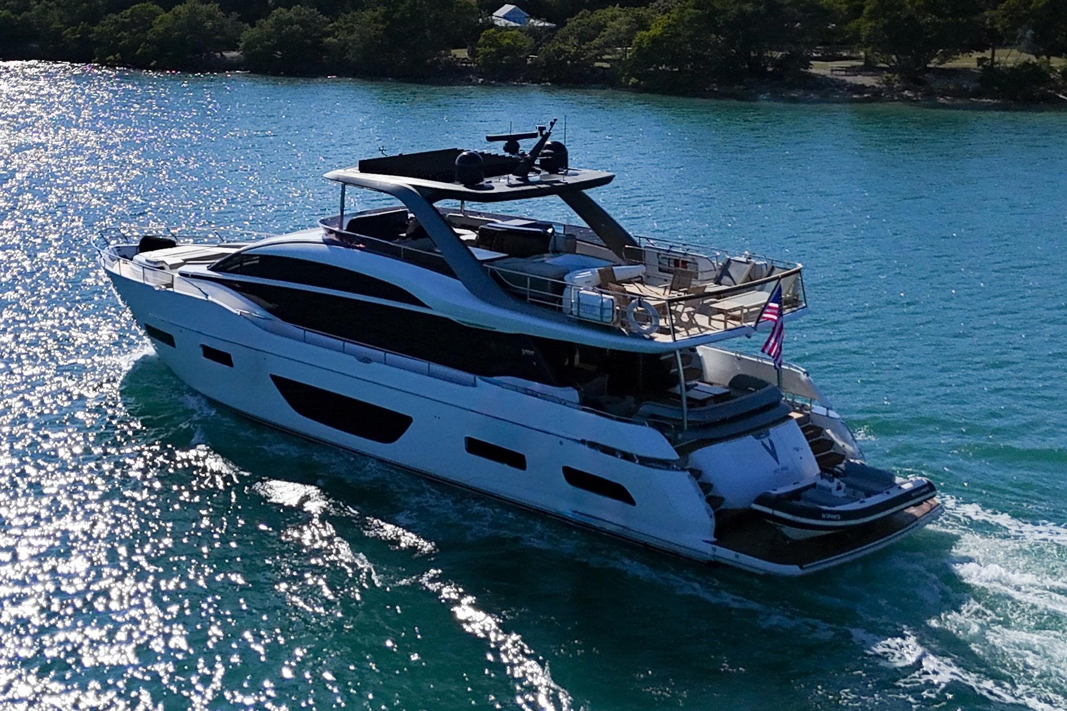 Luxurious 2022 Princess Y85 yacht cruising on sparkling blue waters.