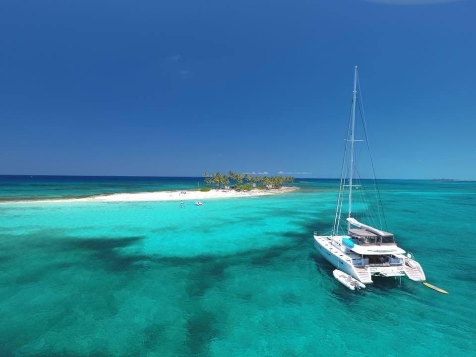 Lagoon 620 catamaran anchored near a tropical island, 2015 model.
