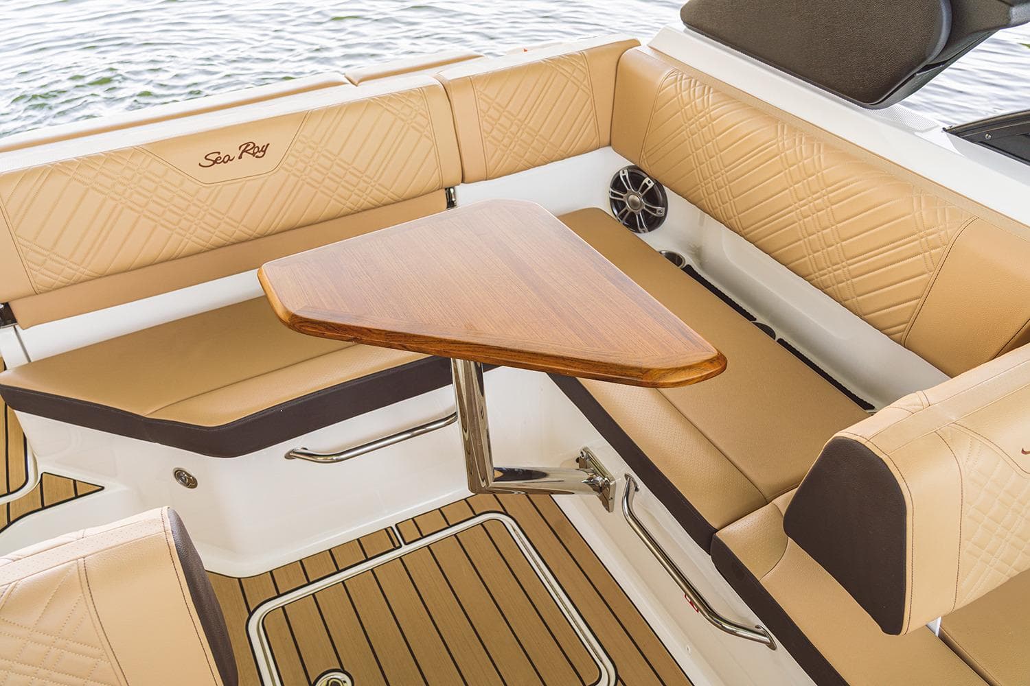 Manufacturer Provided Image: Luxurious interior of 2026 Sea Ray SDX 230 boat with tan seating and wooden table.