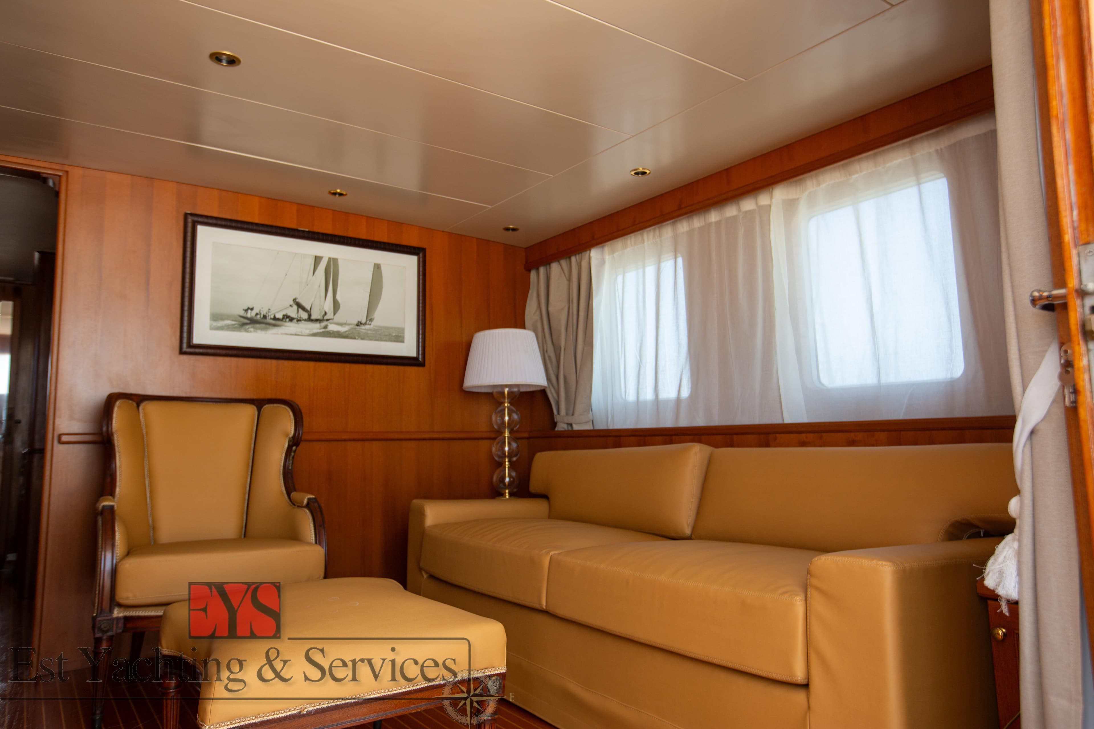 Luxurious interior of a 1972 Benetti 33 yacht with elegant seating and nautical decor.
