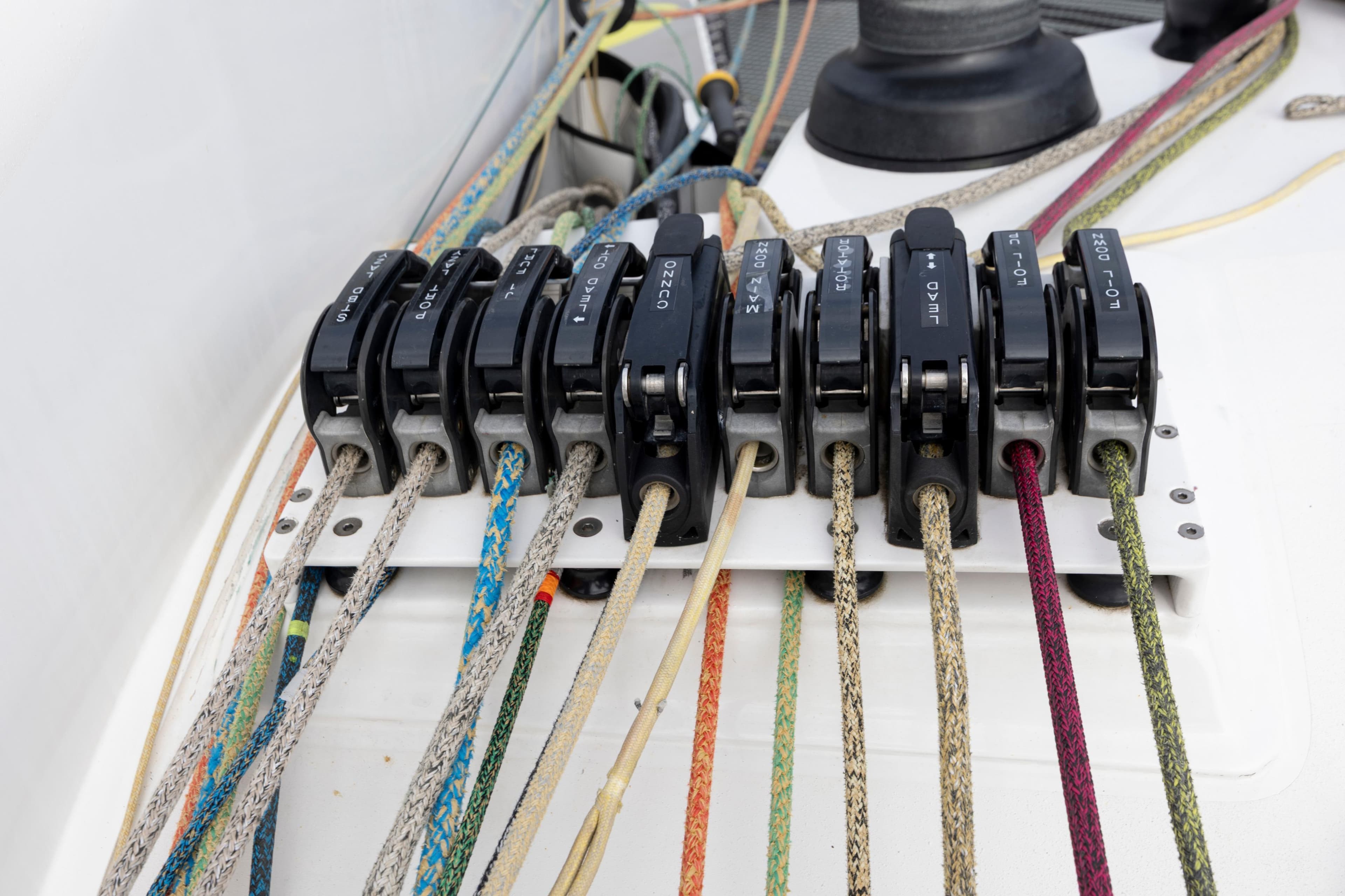 Colorful ropes and clutches on a 2012 CDK Technologies MOD 70 sailboat.