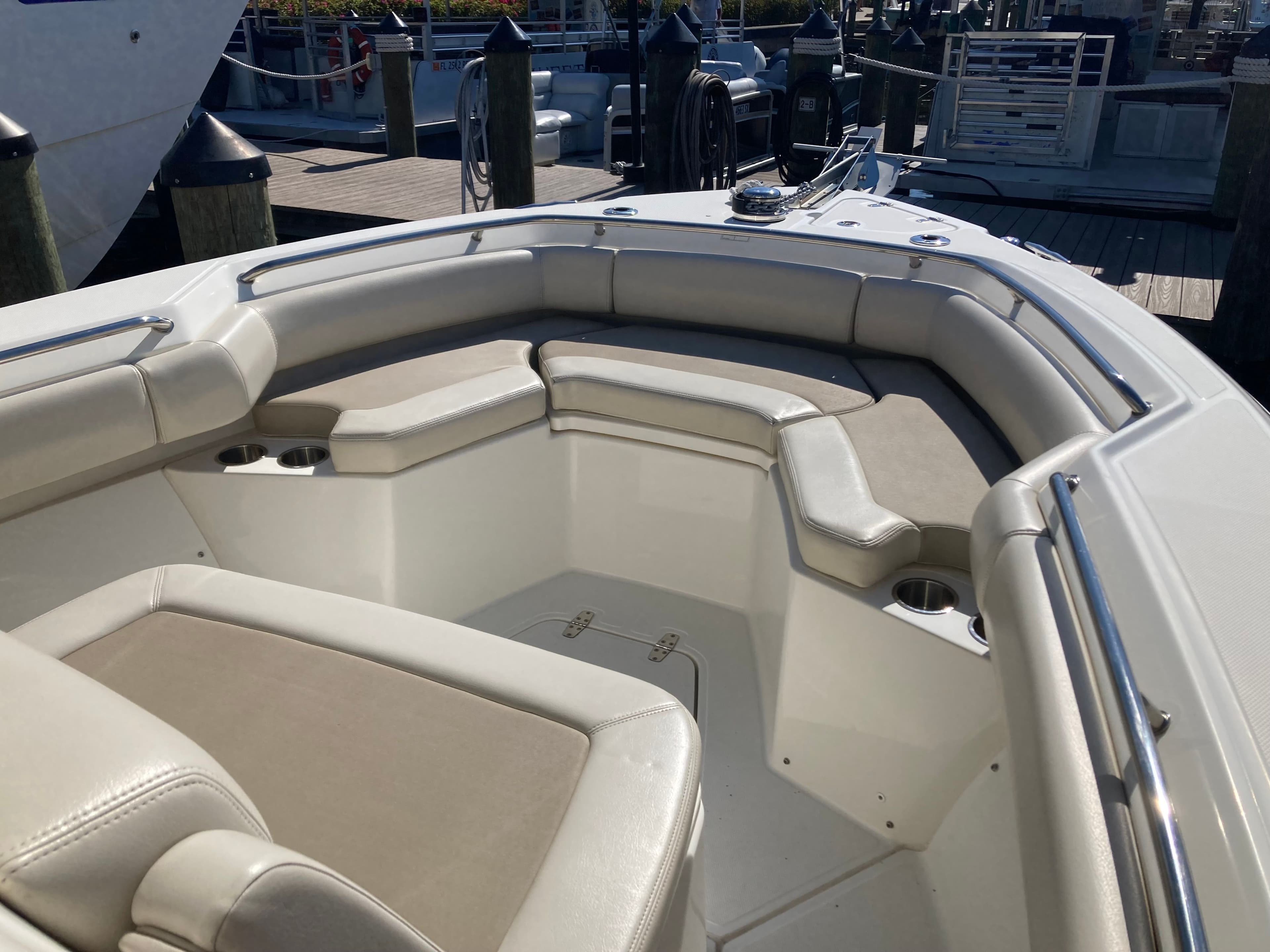 2019 Boston Whaler 250 Outrage with beige seating area on the bow.