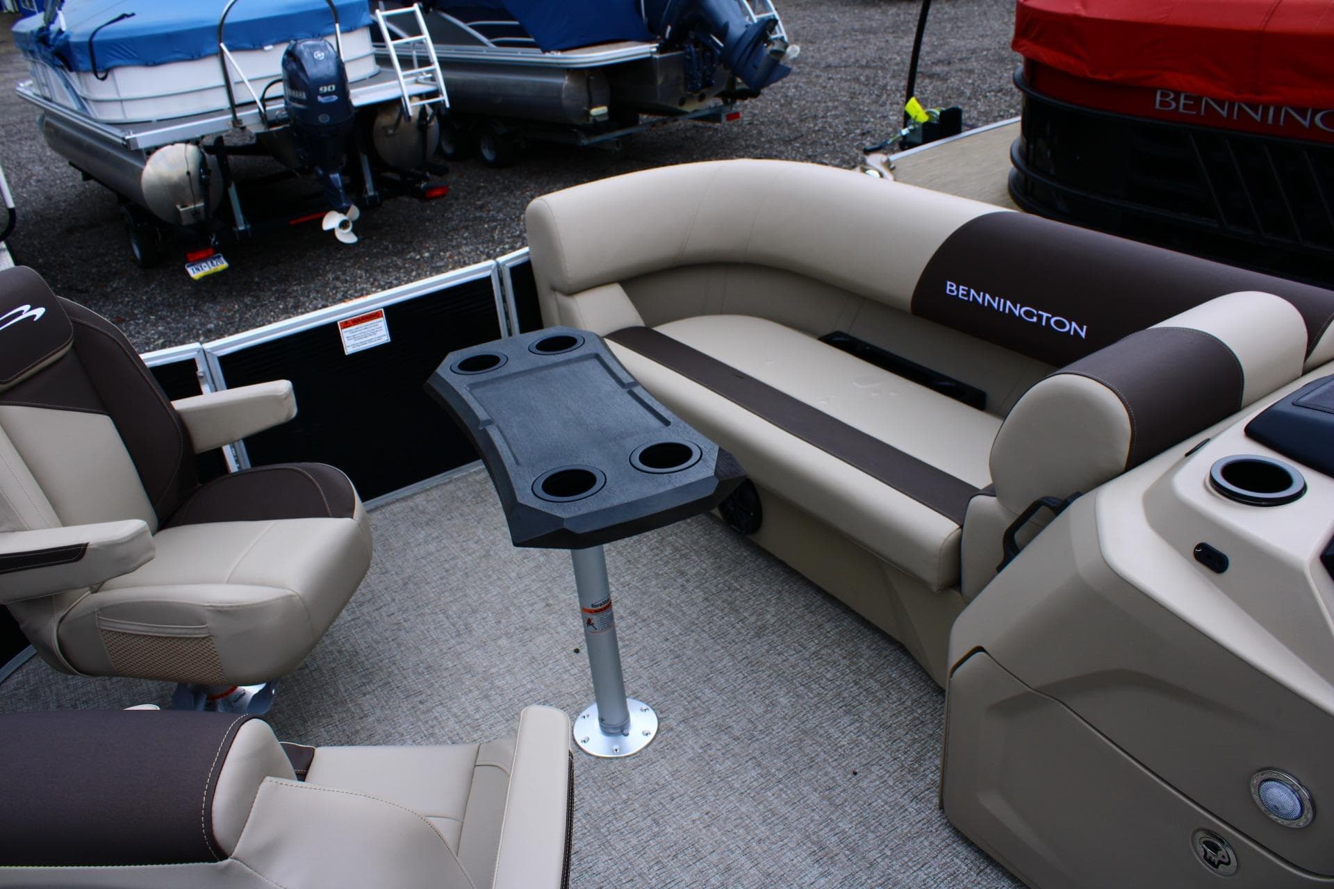 2026 Bennington 21 SSBSF pontoon boat interior with seating and table setup.