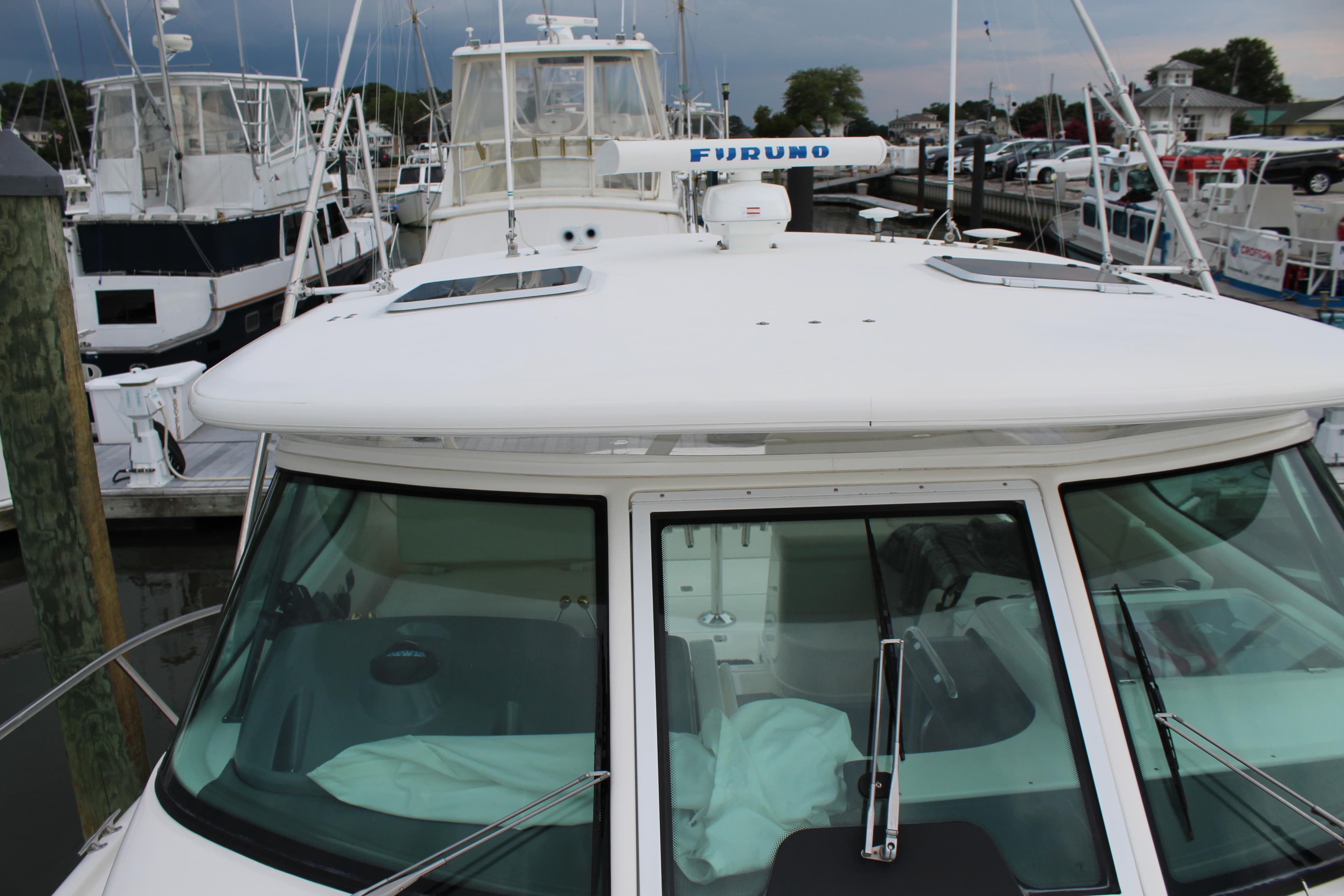 2002 Tiara Yachts 3800 Open docked at a marina, front view.