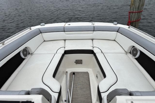2016 Sea Ray 270 Sundeck boat interior with white seating and water view.