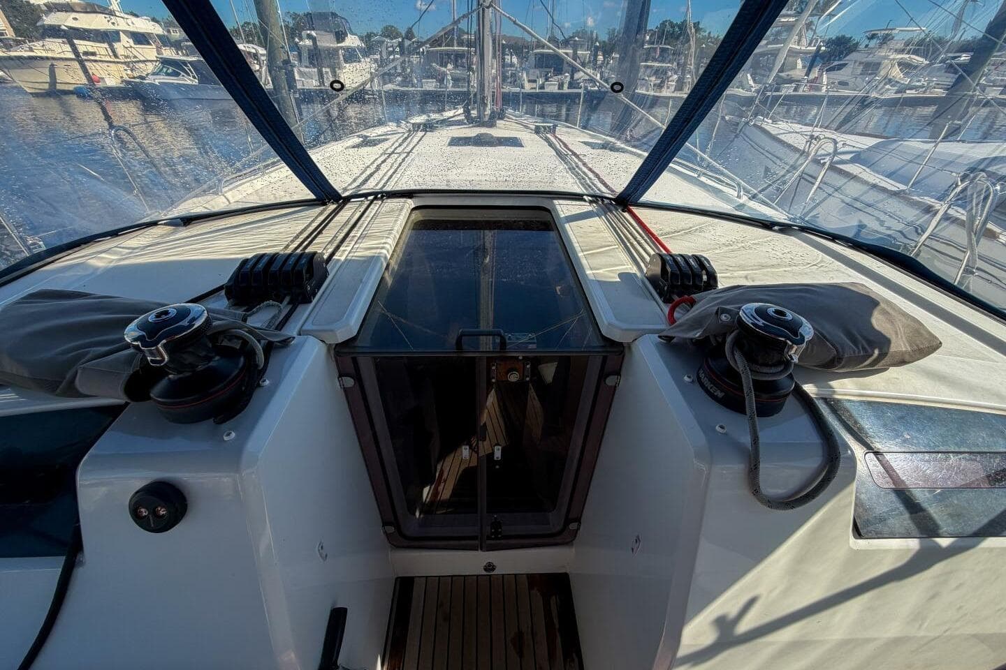 2022 Beneteau Oceanis 40.1 yacht cockpit with winches and clear canopy view.