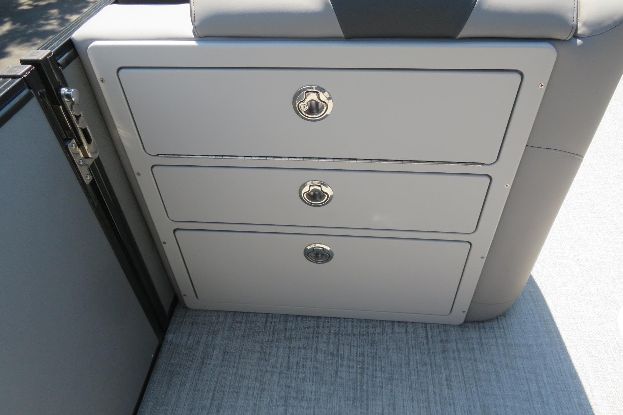 2026 Avalon Catalina Quad Lounge Shift boat storage compartments with sleek design and secure latches.