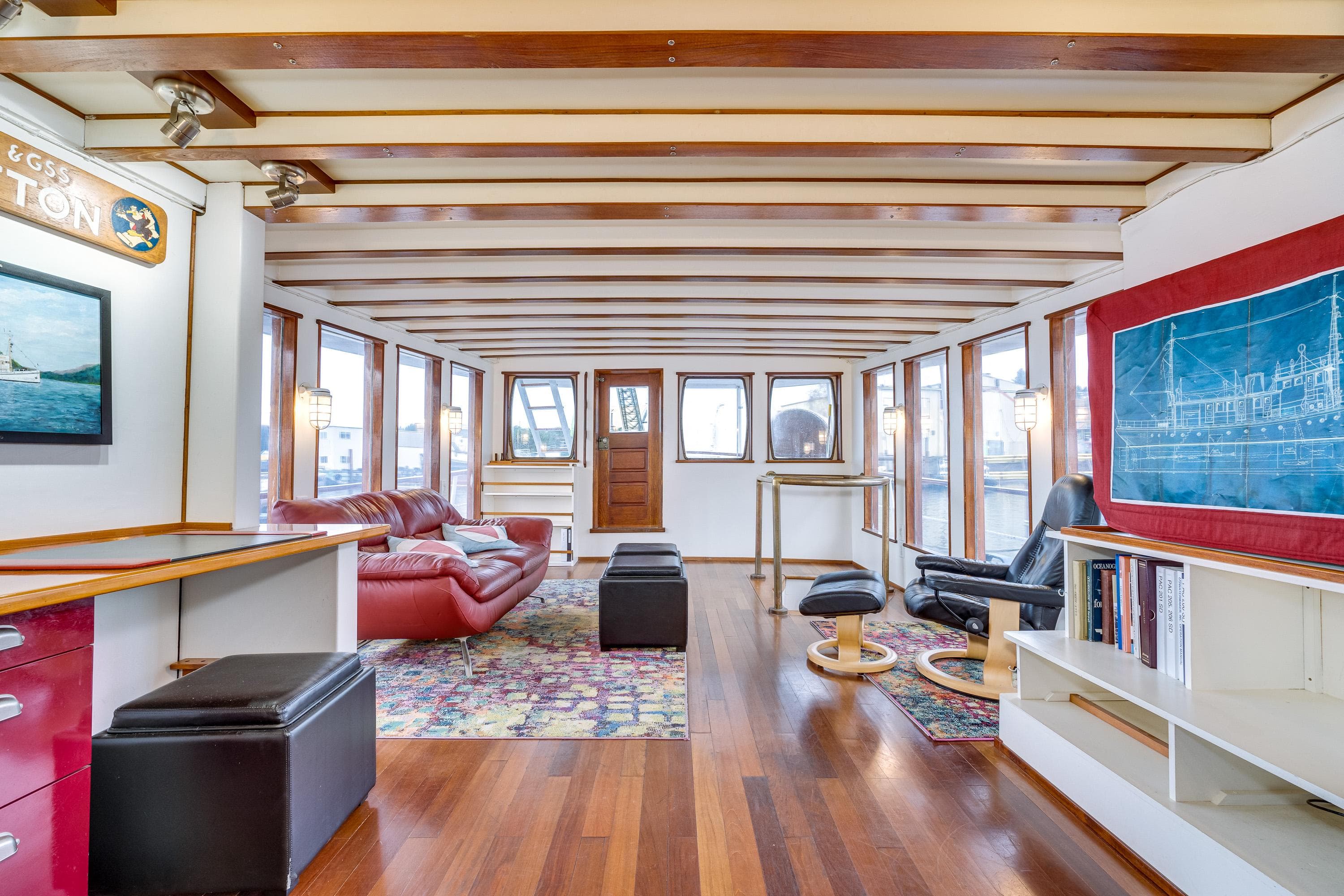 Spacious 1941 Custom Sagstad Fantail interior with wooden beams, modern furnishings, and large windows.