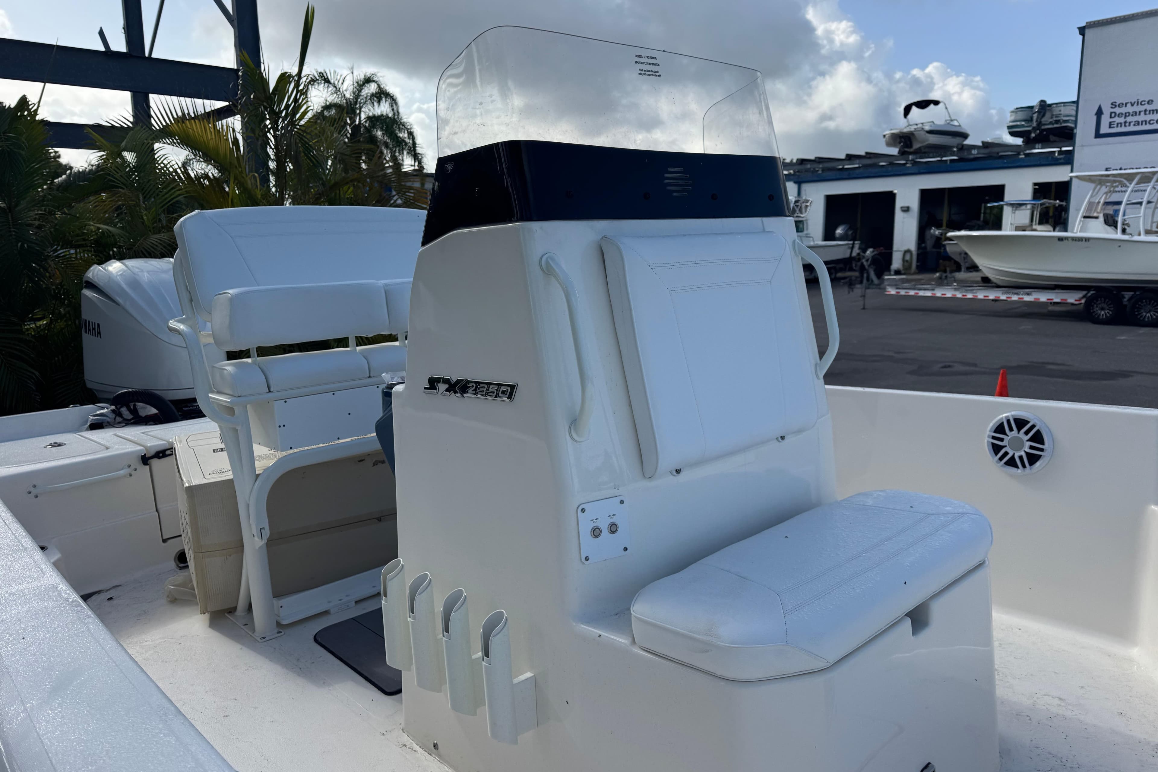 2025 Skeeter SX2350 boat interior with seating and console, parked at a marina.