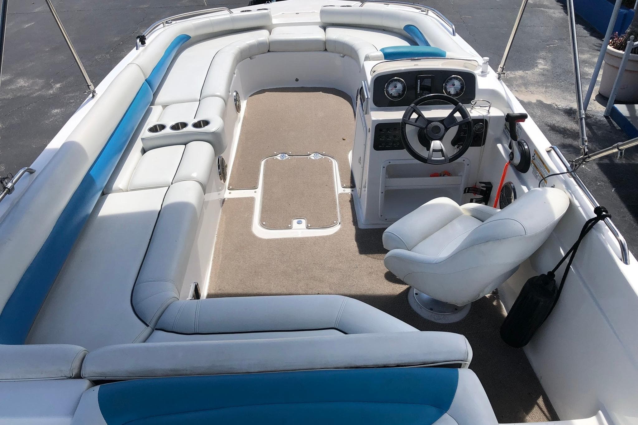 2014 Hurricane SunDeck Sport 201 IO boat interior with seating and steering console.
