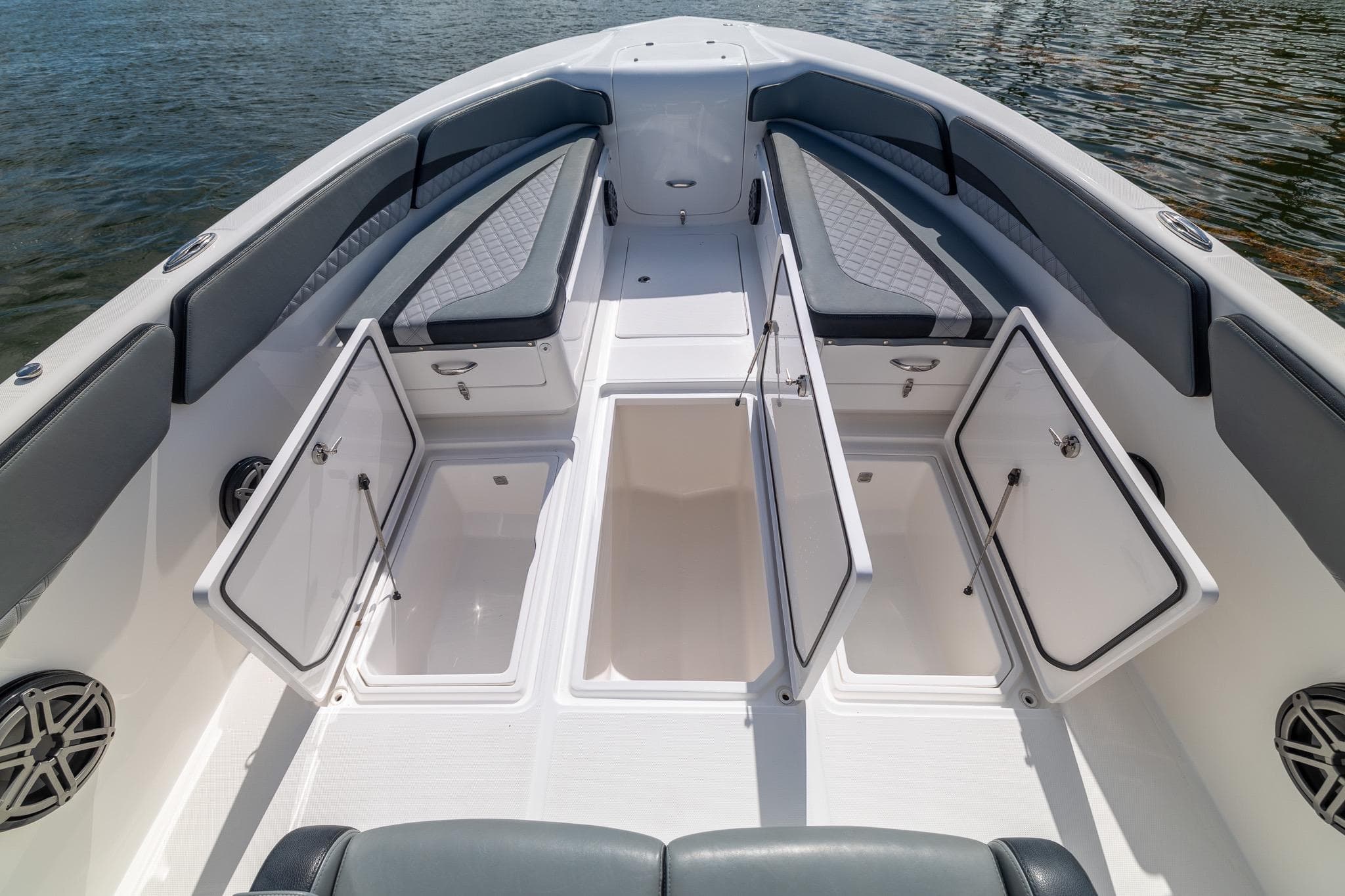 2019 Deep Impact 369 Sport boat interior with open storage compartments and cushioned seating.