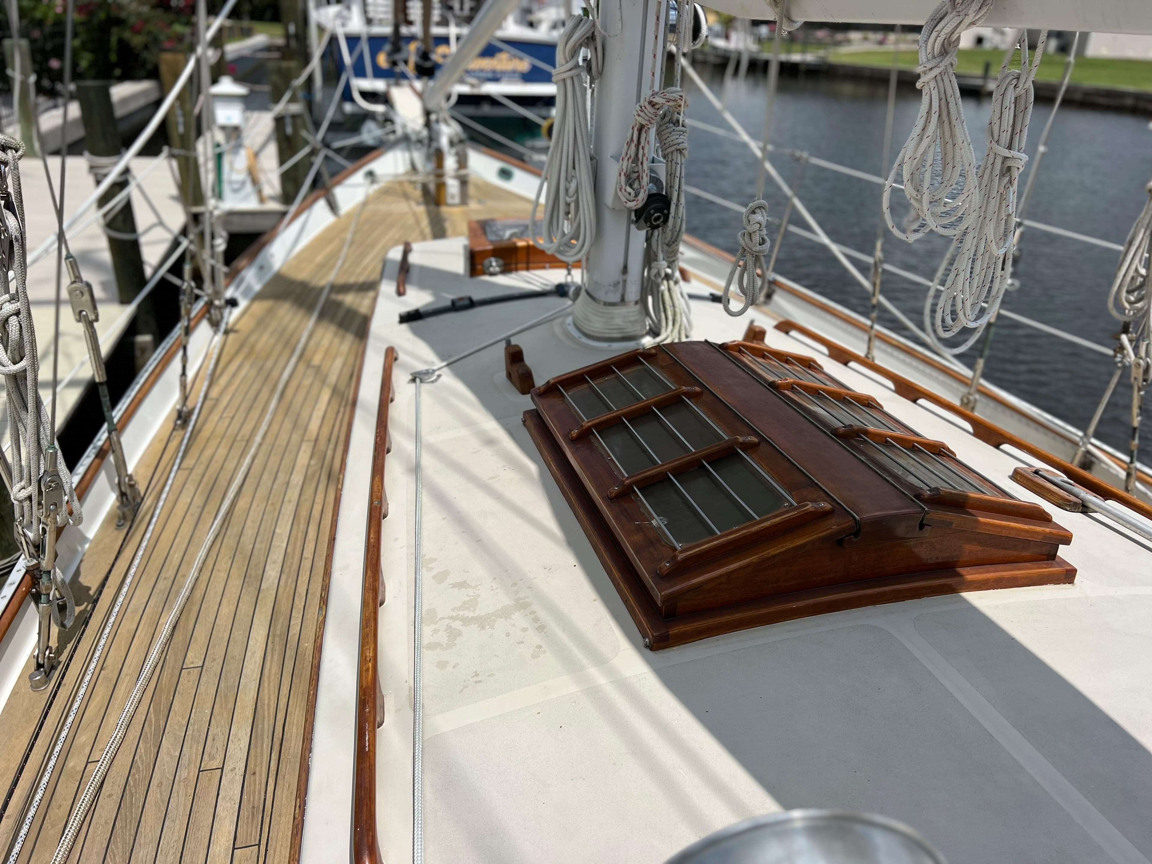 1986 Cherubini 44 sailboat deck with wooden accents and rigging.