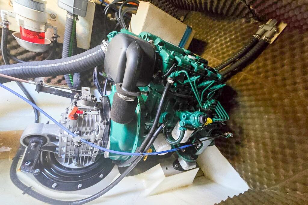 Engine compartment of a 2006 Dolphin 460, showcasing mechanical components and wiring.