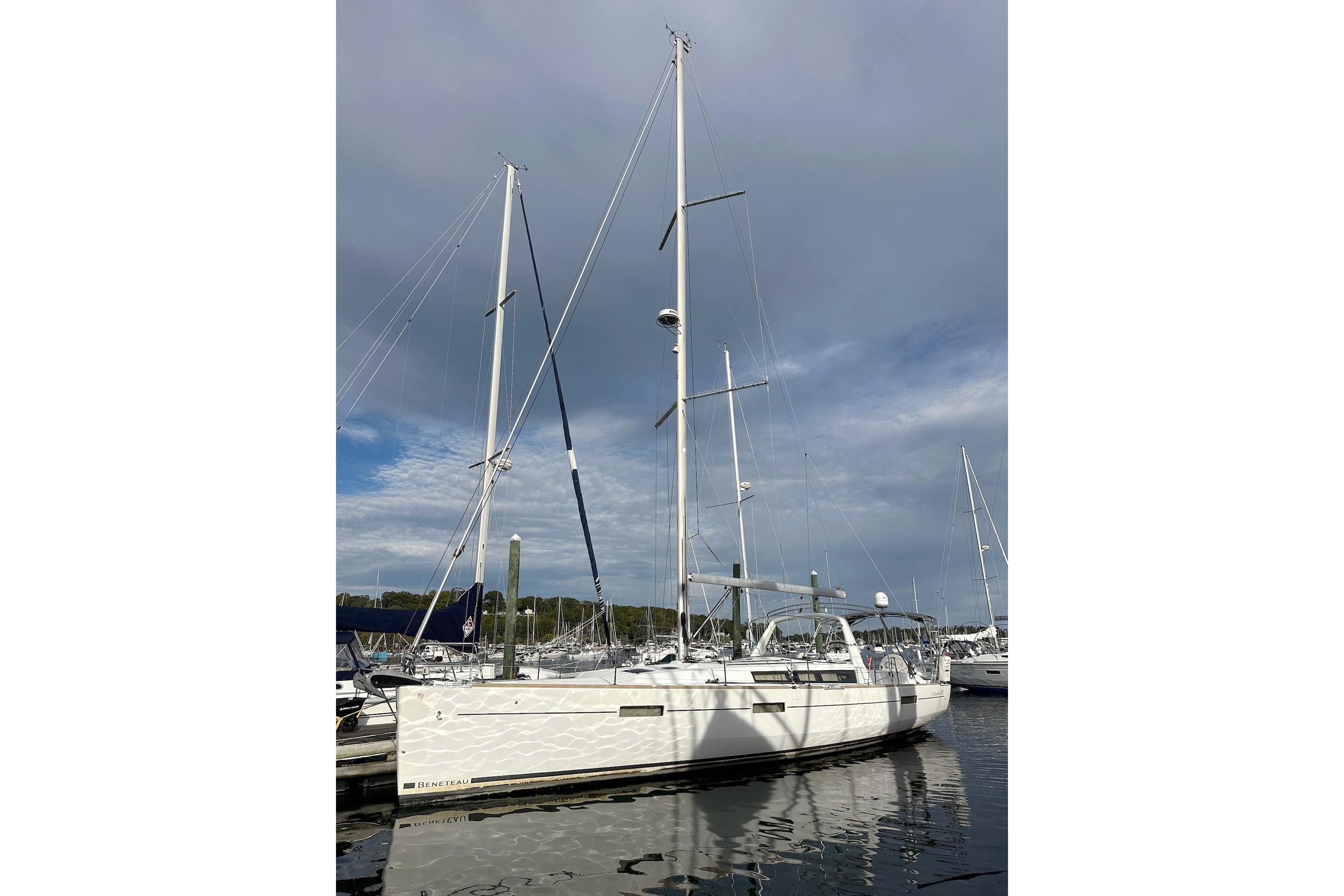2017 Beneteau Oceanis 45 sailboat docked under cloudy sky.