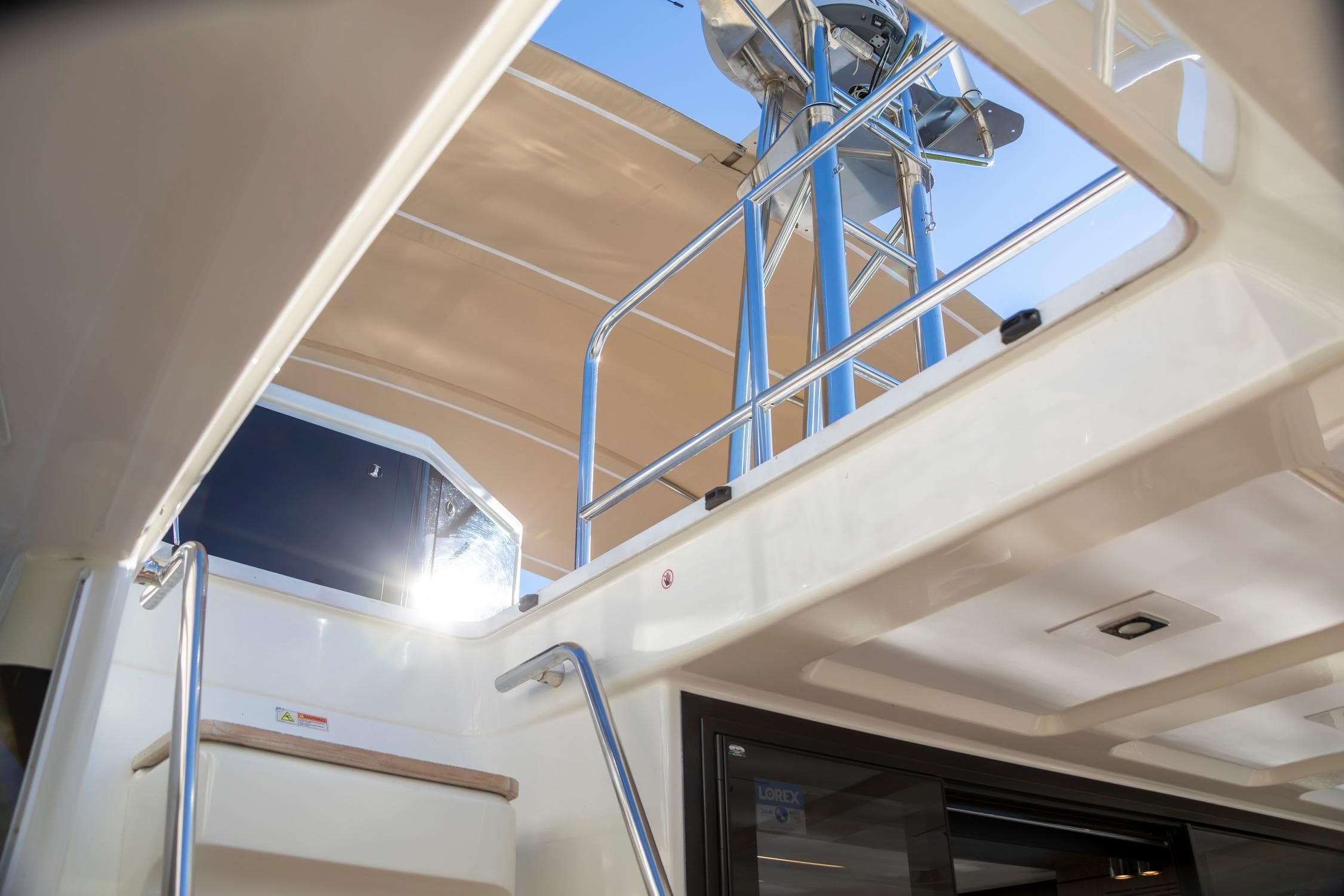 2018 Cranchi Eco Trawler 53 Long Distance interior with stairs and railing, under sunny sky.