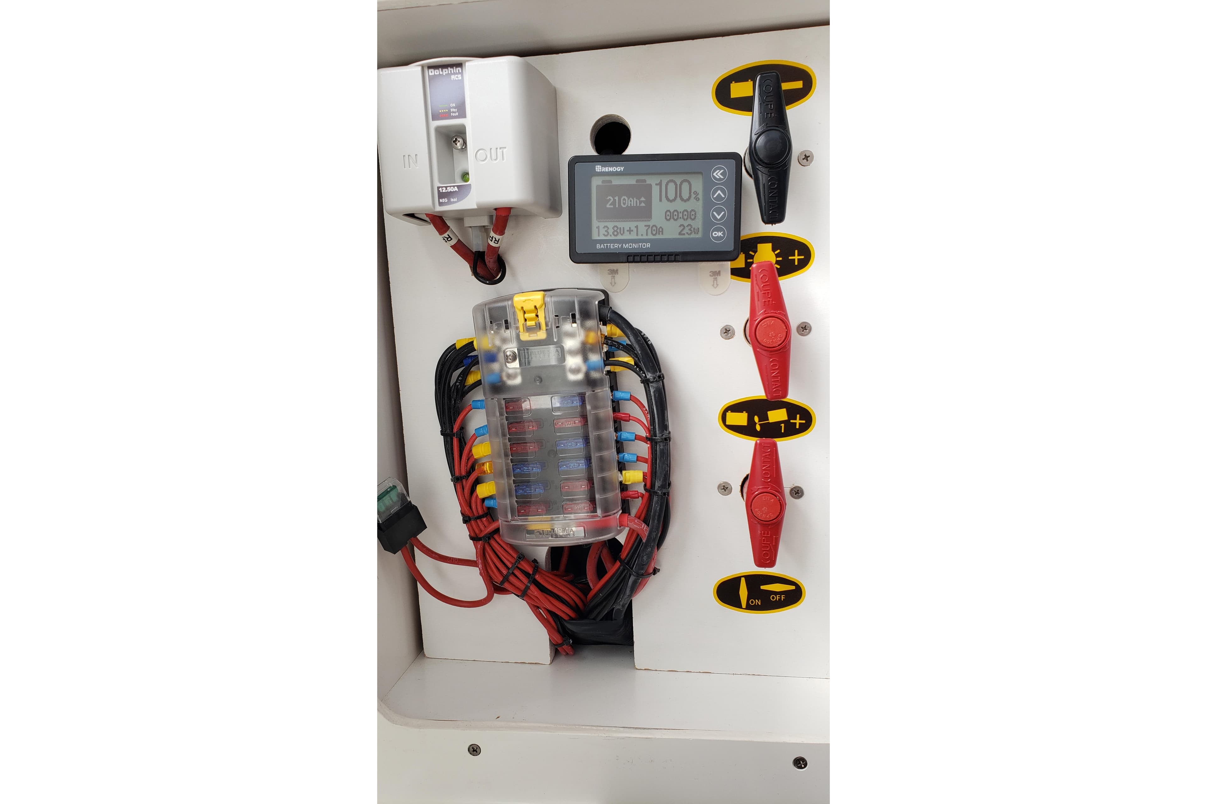 Electrical panel of a 2019 Beneteau Antares 23 boat with wiring and controls.