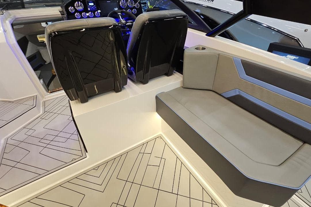 Interior of 2026 Hanover 327 boat with modern seating and dashboard design.