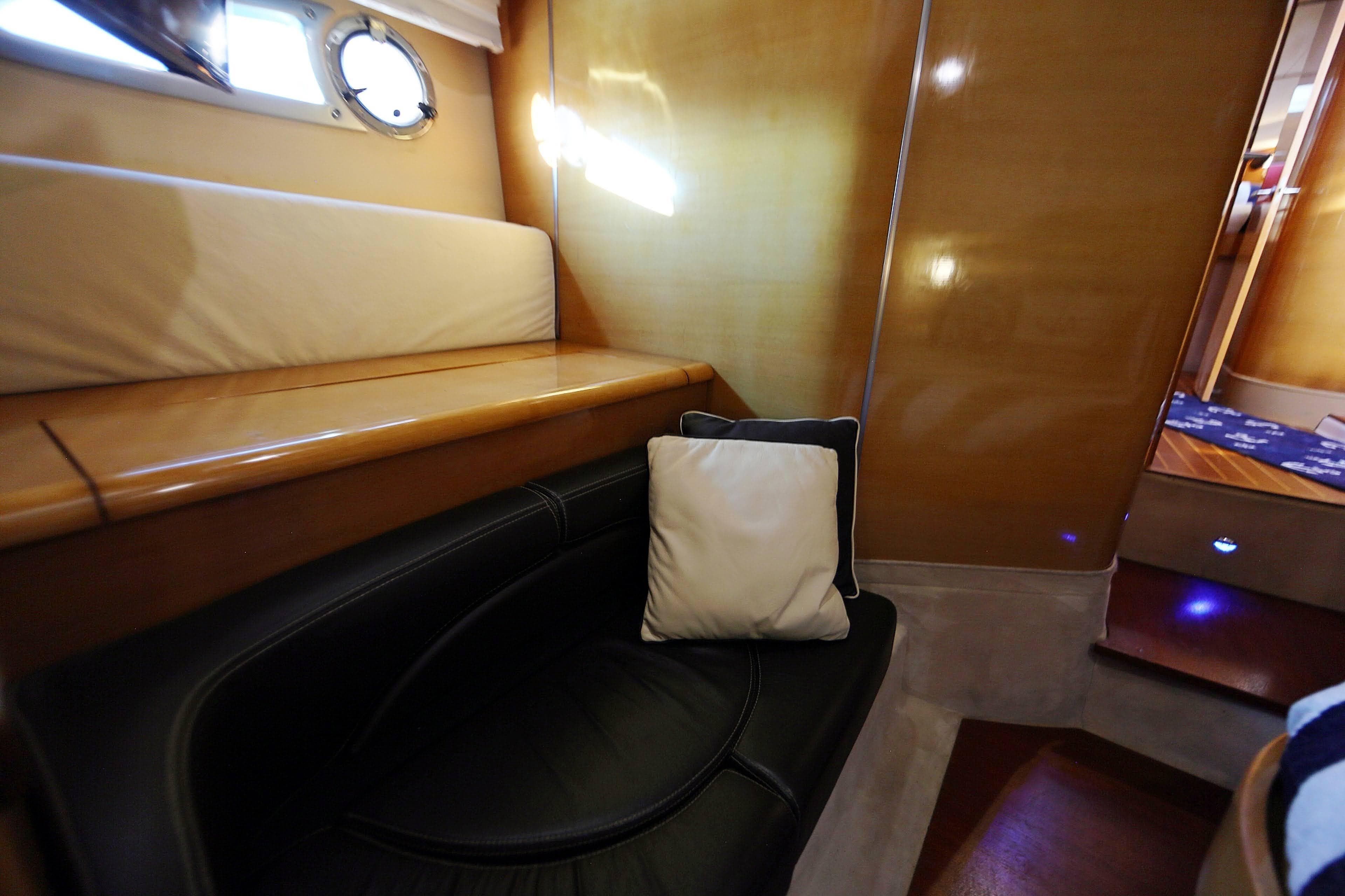 Interior of 2008 Cranchi Mediterranee 43 yacht with leather seating and wooden finishes.