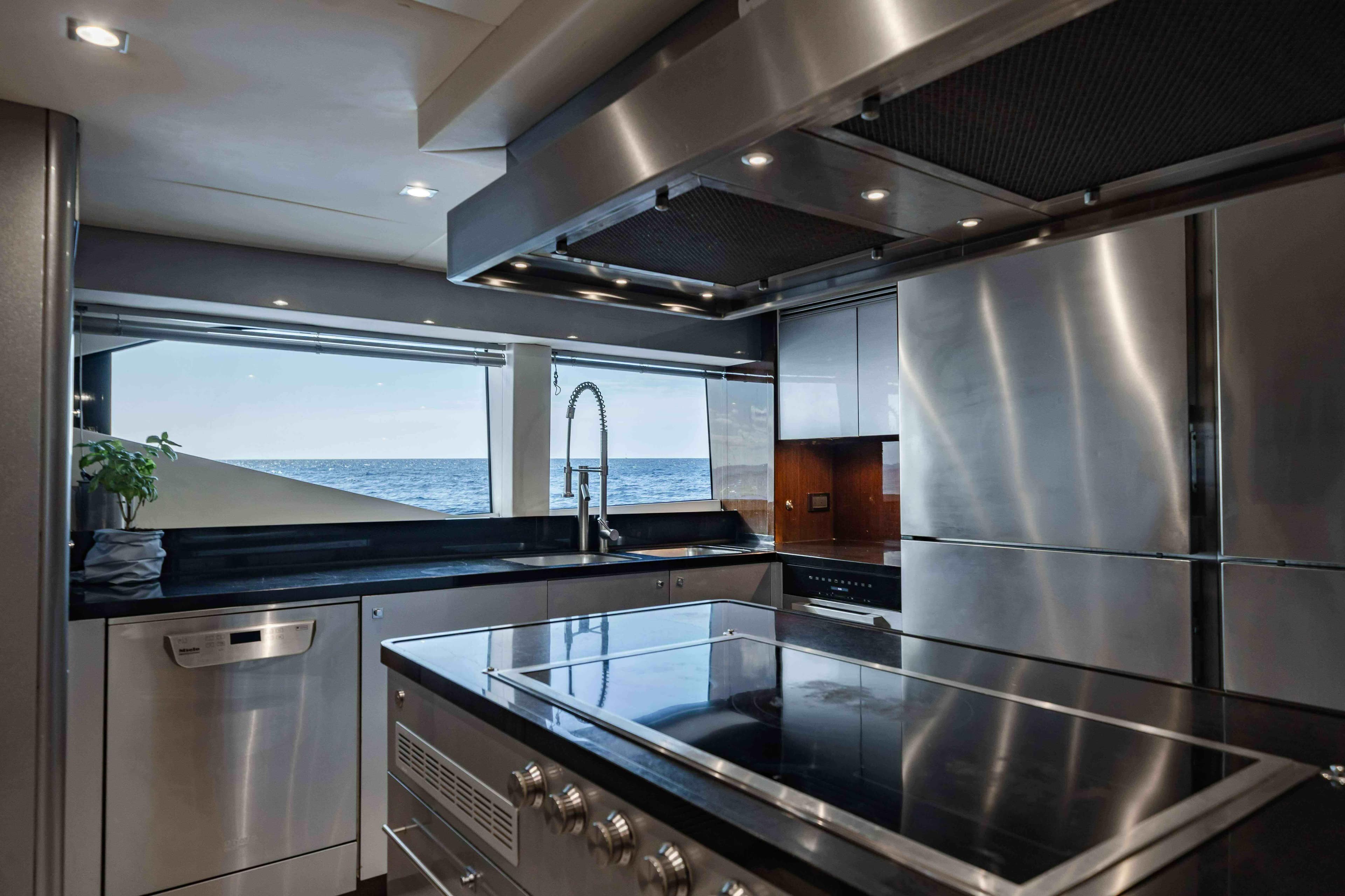 Luxurious kitchen interior of 2016 Sunseeker 131 Yacht with ocean view.