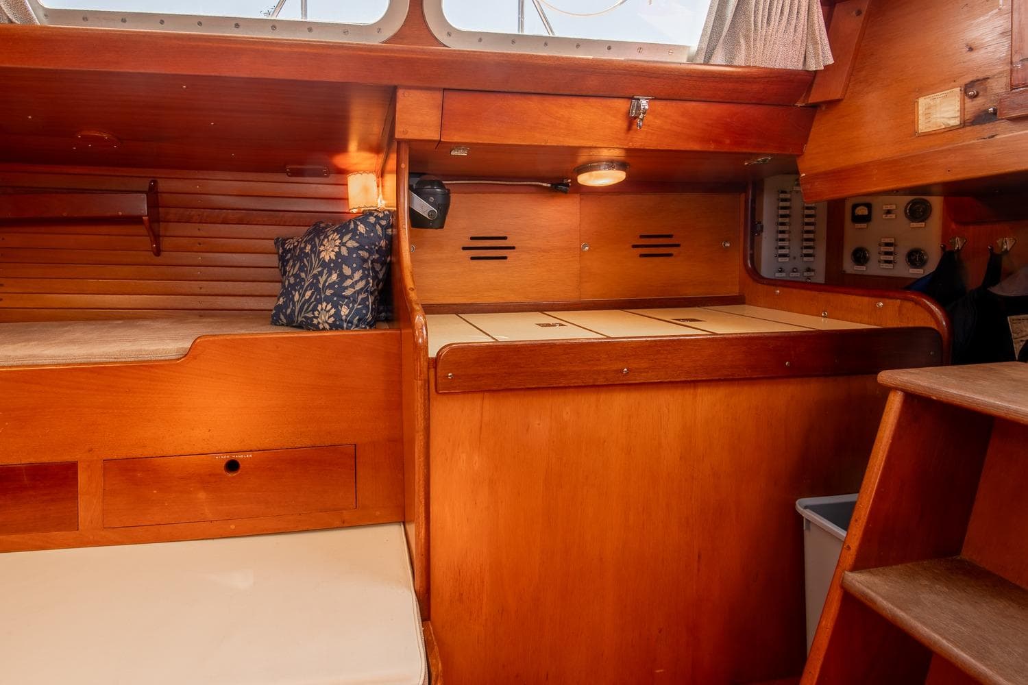 Interior of 1971 Hinckley Bermuda 40 Custom Yawl, featuring wooden cabinetry and seating.