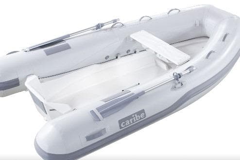 2025 Caribe L-10 inflatable boat, white with gray accents, featuring oars and seating.