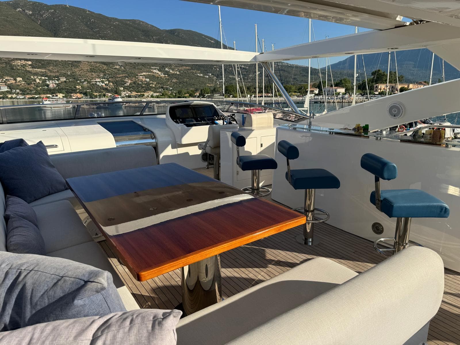 Luxurious Sunseeker 30 Metre Yacht 2012 with elegant outdoor seating and scenic marina view.