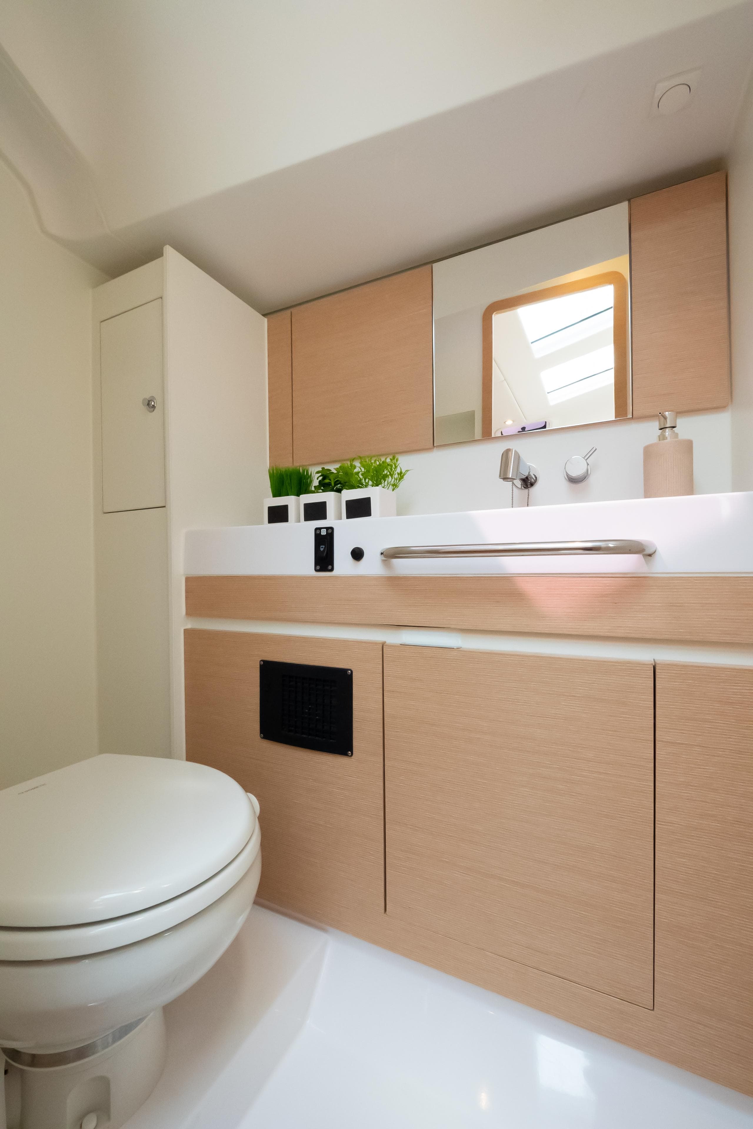 Modern bathroom interior in 2018 Elan Impression 50 yacht, featuring sleek design and fixtures.
