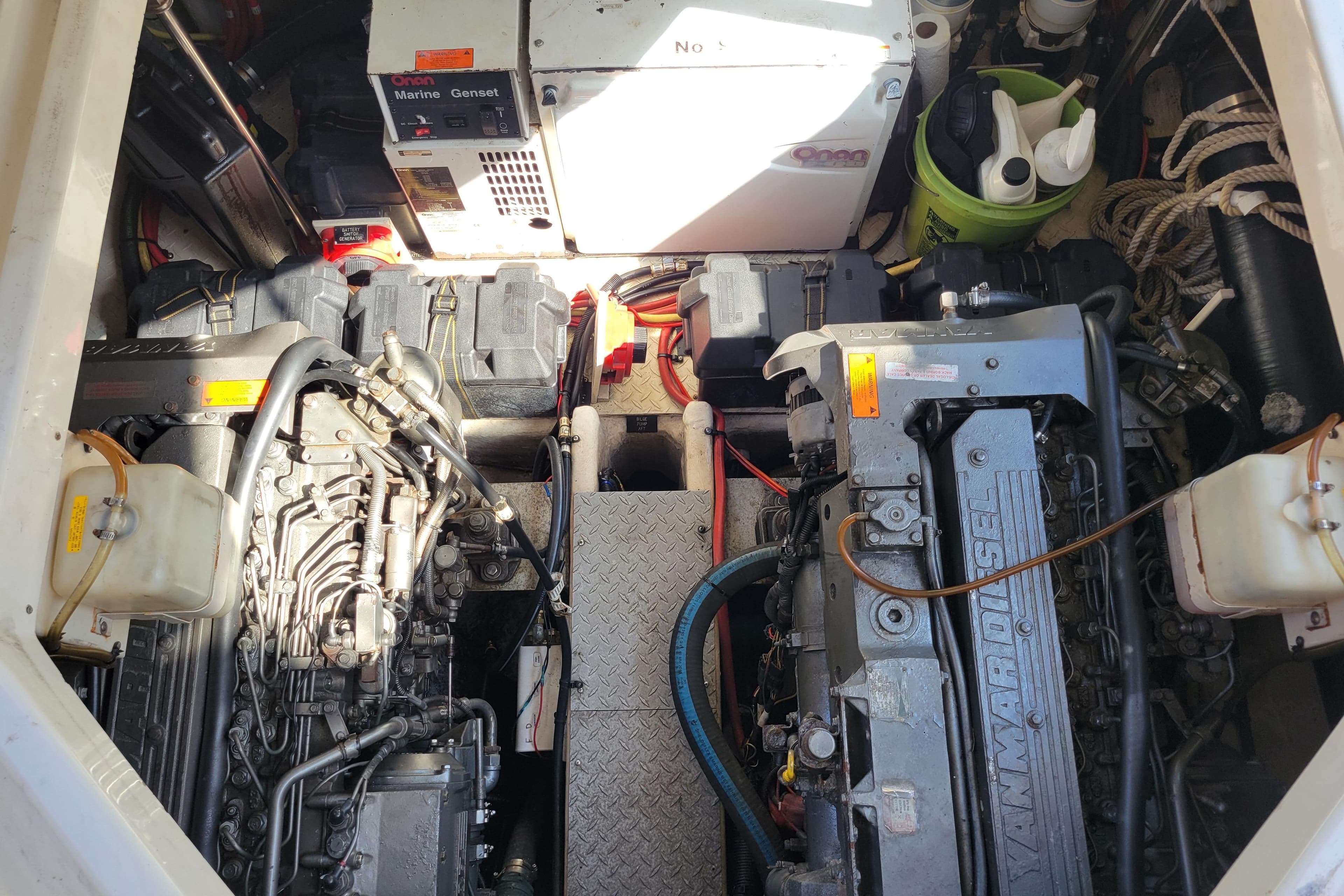 Engine room of 2004 Cruisers Yachts 400 Express with Yanmar diesel engines and Onan marine generator.