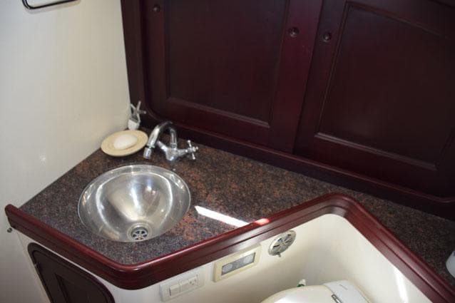 Granite vanity with sink in galley