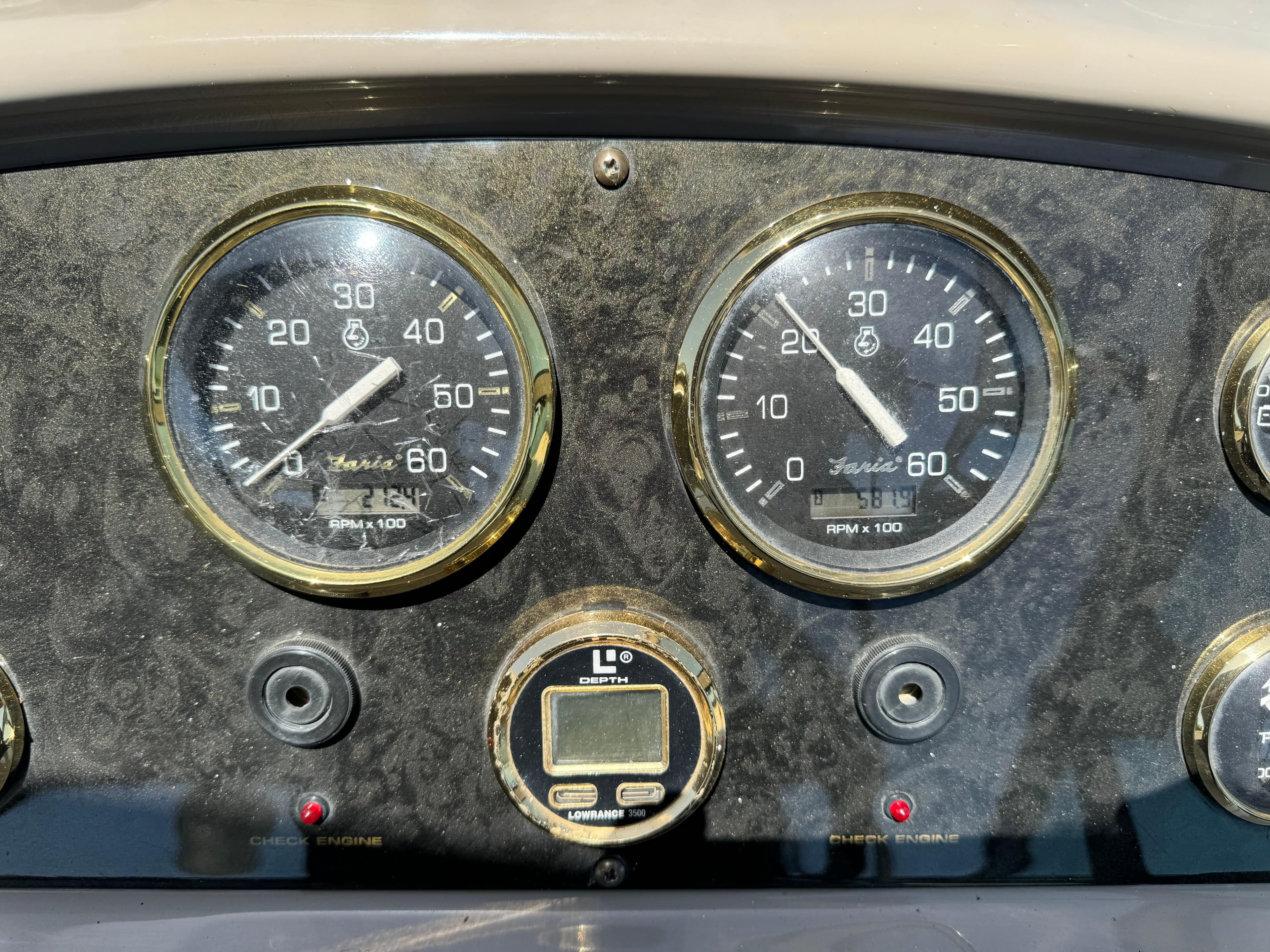 Dashboard of 2004 Cruisers Yachts 320 Express with gauges and depth finder.