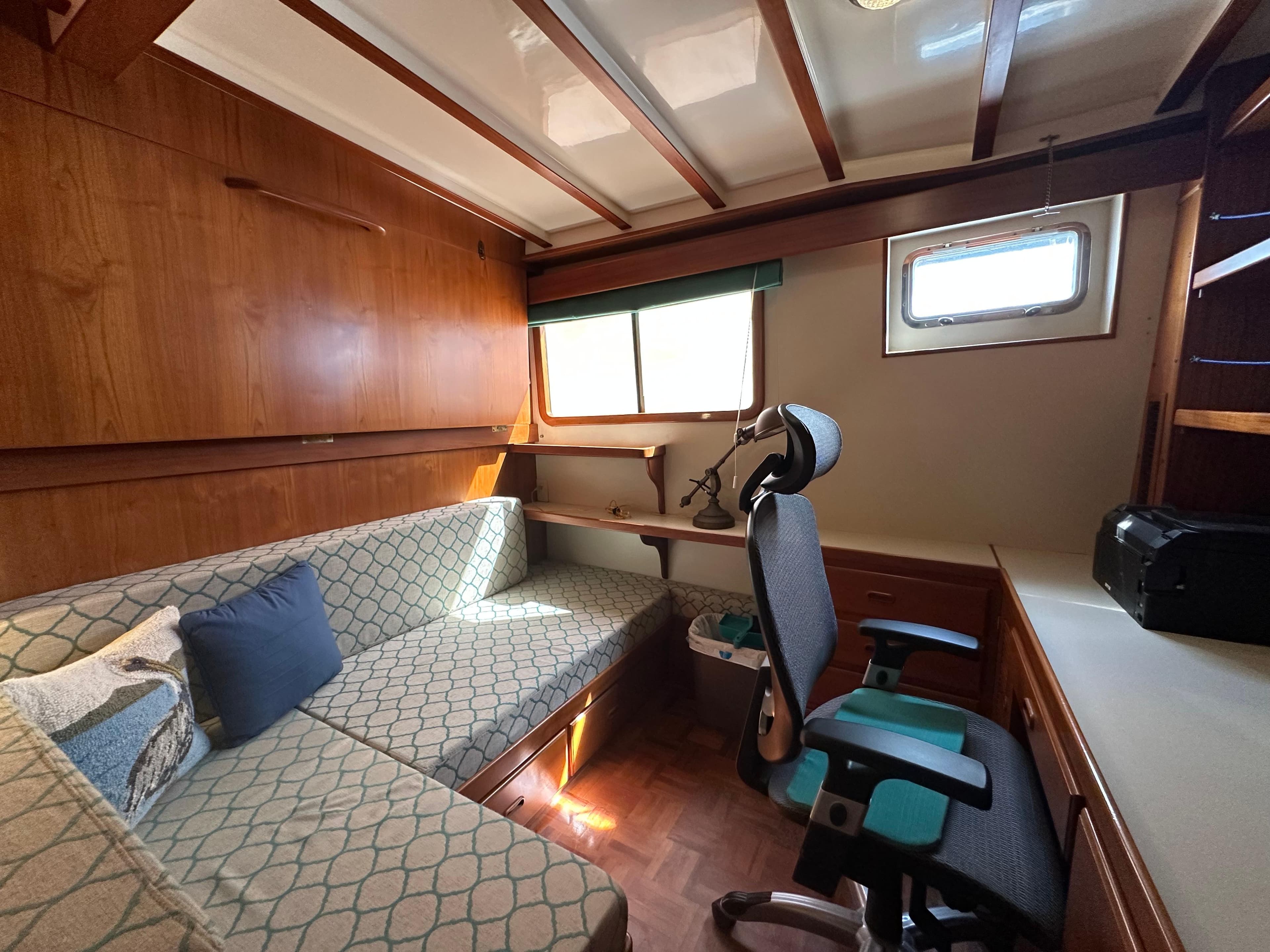 Interior of 1997 Kadey-Krogen 48 Whaleback with cozy seating and workspace.