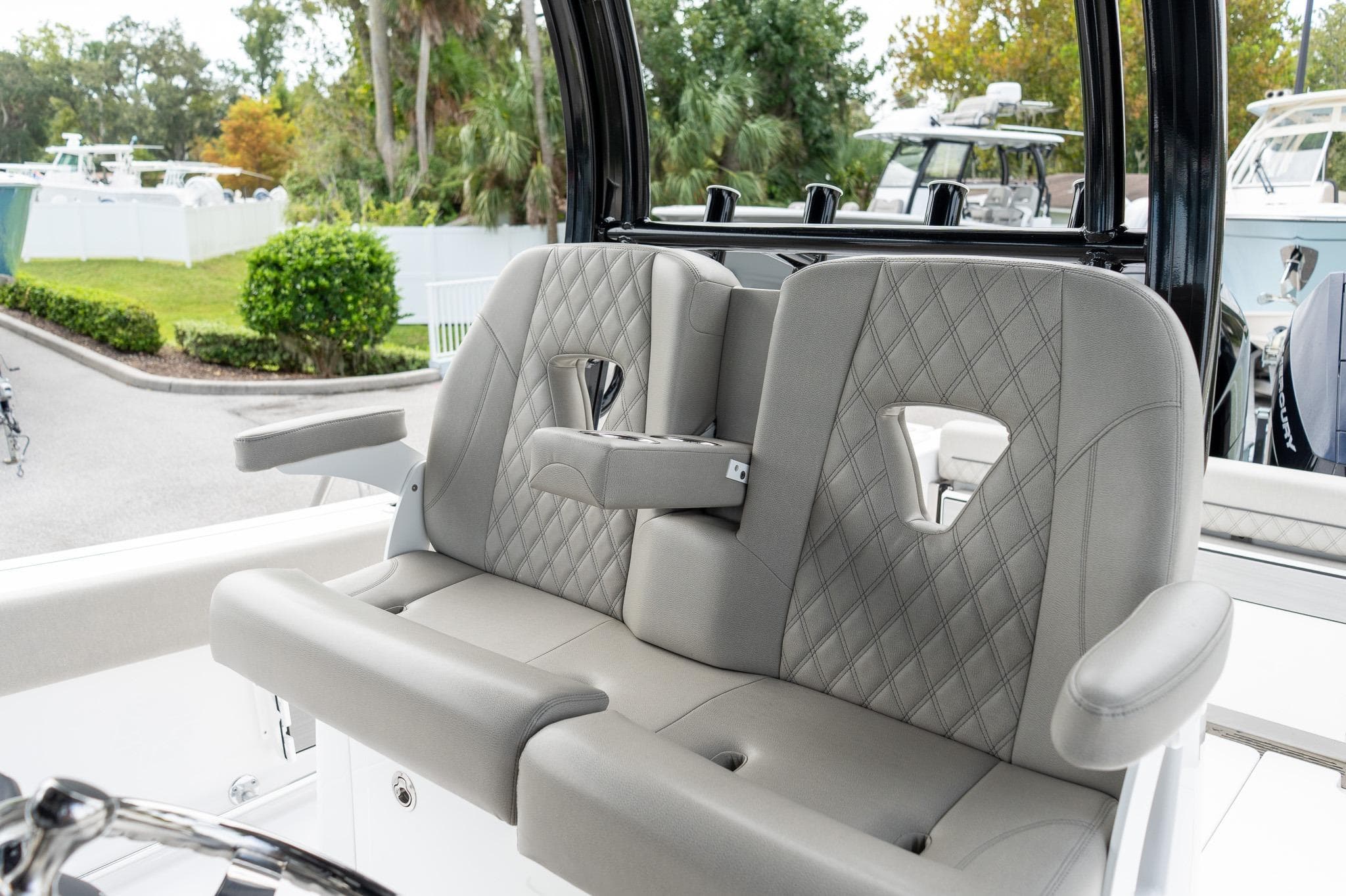 2025 Sportsman Open 322 Center Console boat seats with diamond stitching and armrests.