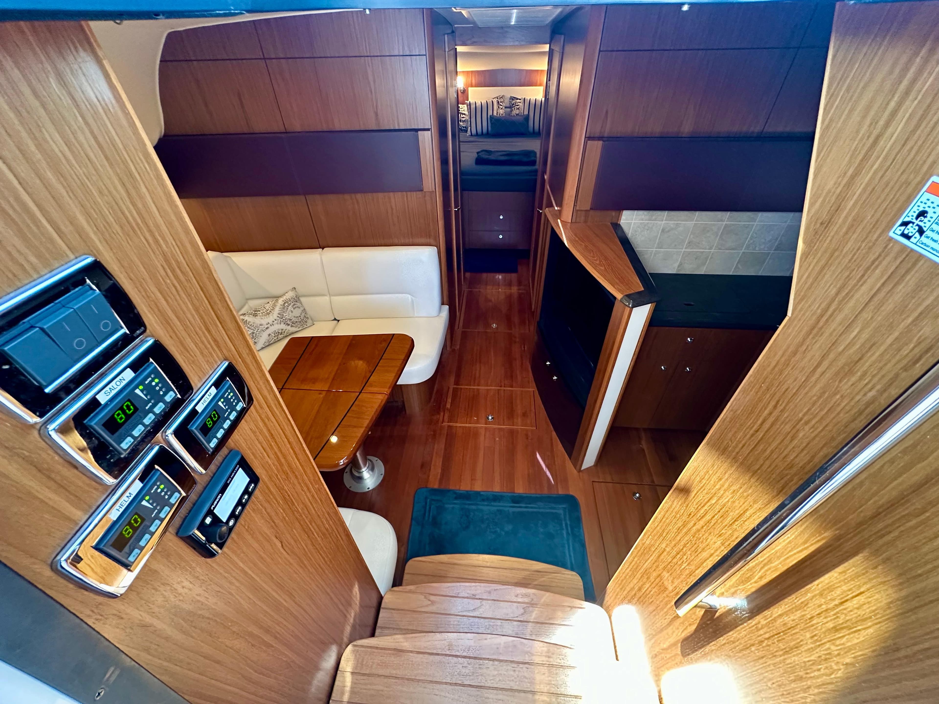 Interior of 2018 Tiara Yachts 4300 Open, featuring wood finishes and modern amenities.