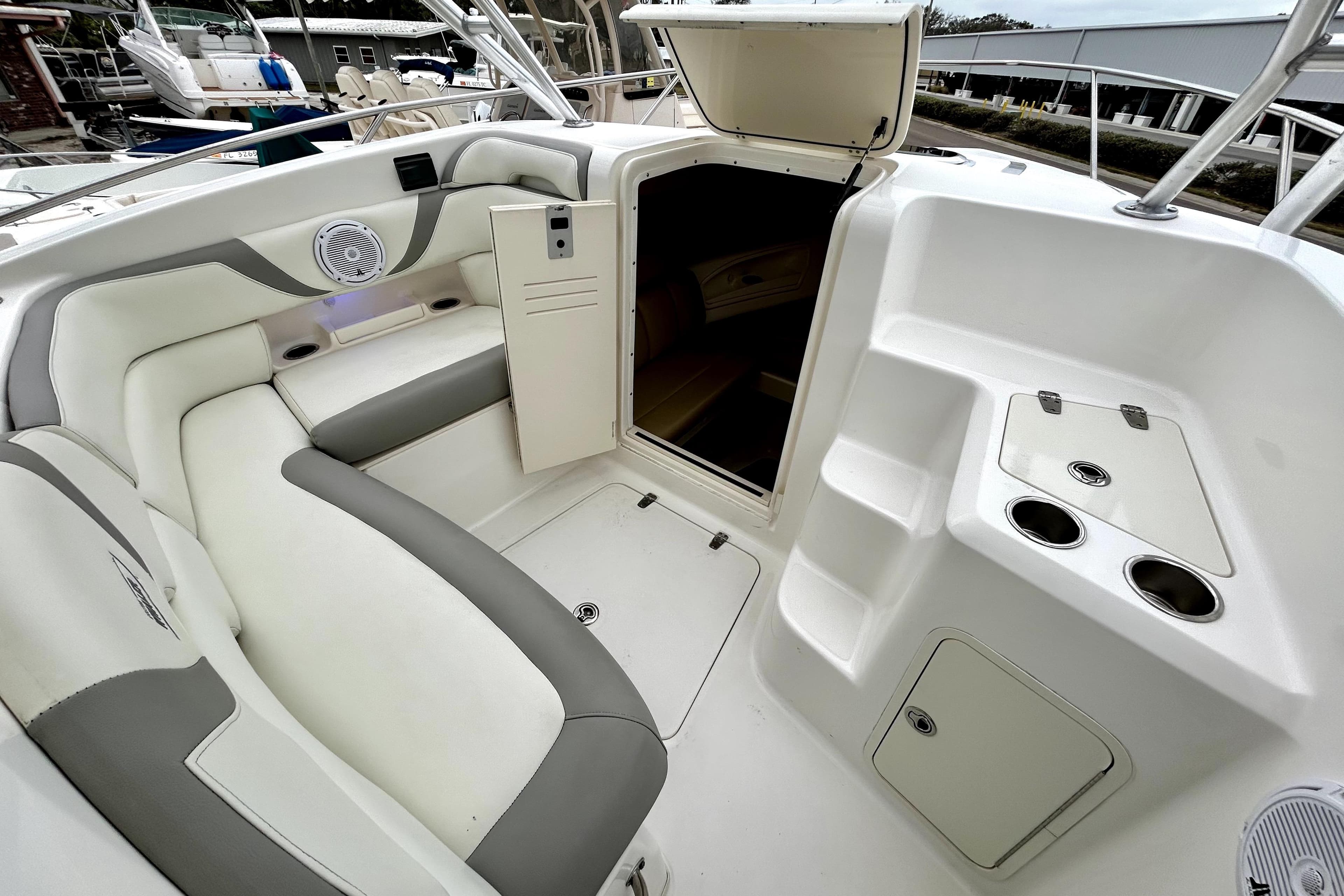 2008 Boston Whaler 320 Outrage Cuddy Cabin interior with seating and storage compartments.