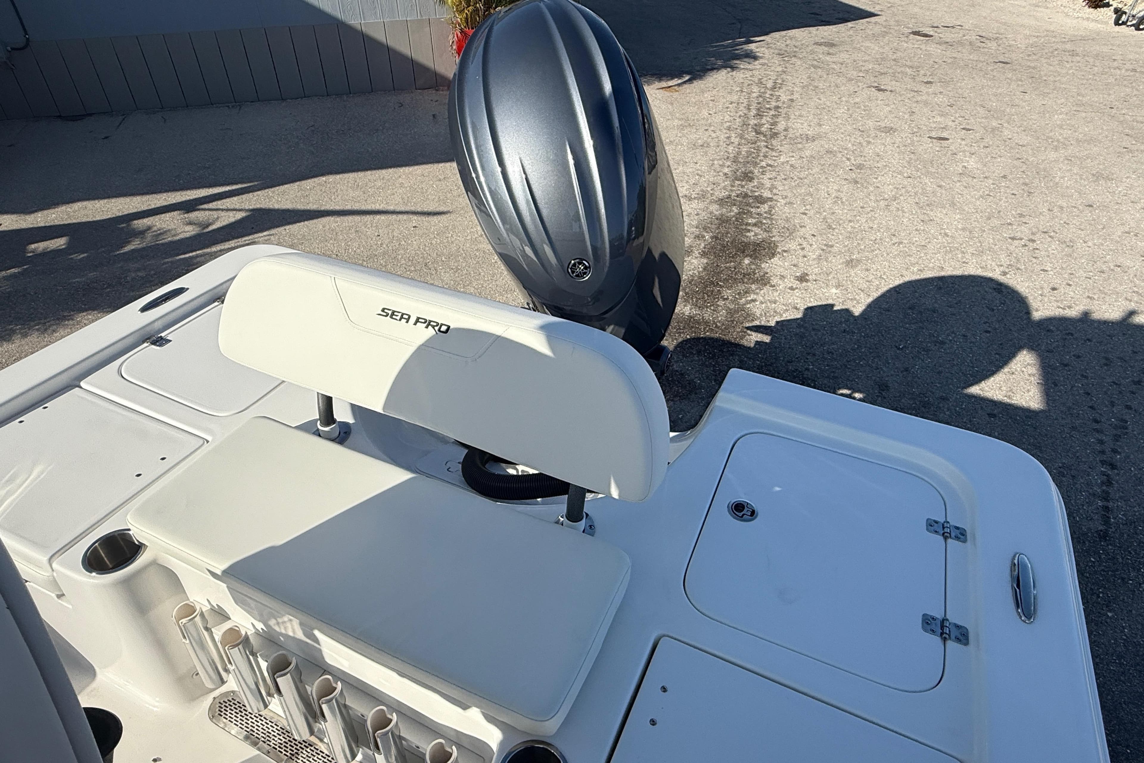 2025 Sea Pro 210 Bay boat with outboard motor and seating area.