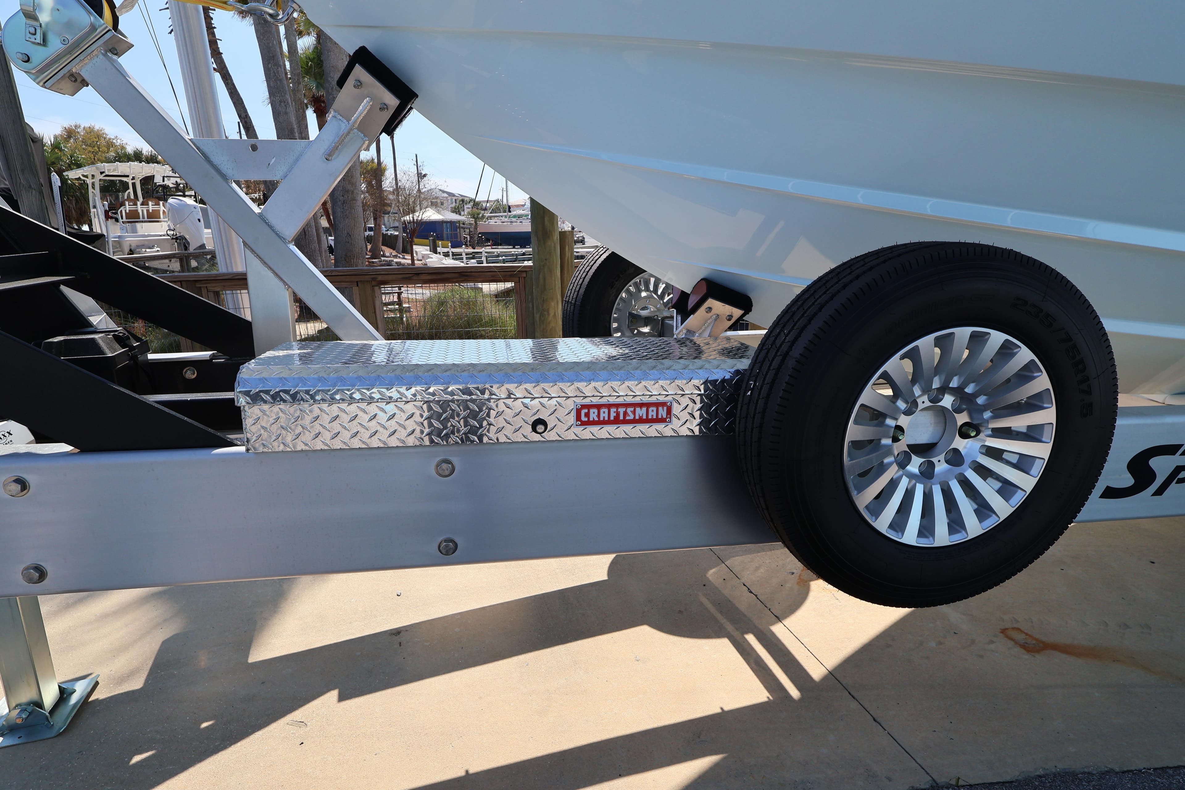 Trailer with Craftsman toolbox and wheel for 2026 Contender 44 CB boat.