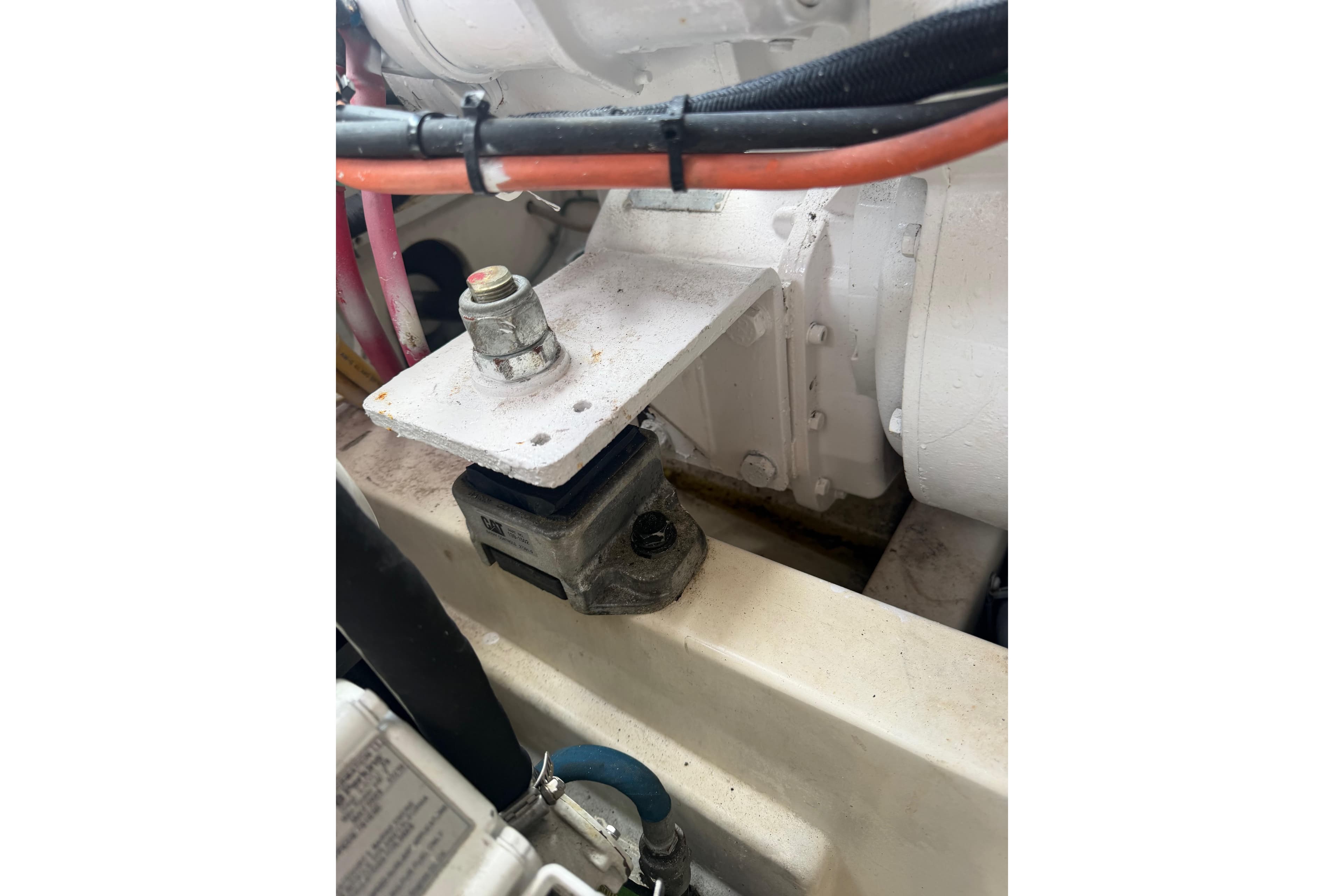 Engine component of a 2003 Cabo 35 Express boat, featuring cables and mounting hardware.