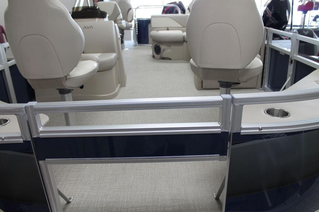 2025 Avalon Venture 85 Quad Fish 21 FT interior with beige seating and metal railings.
