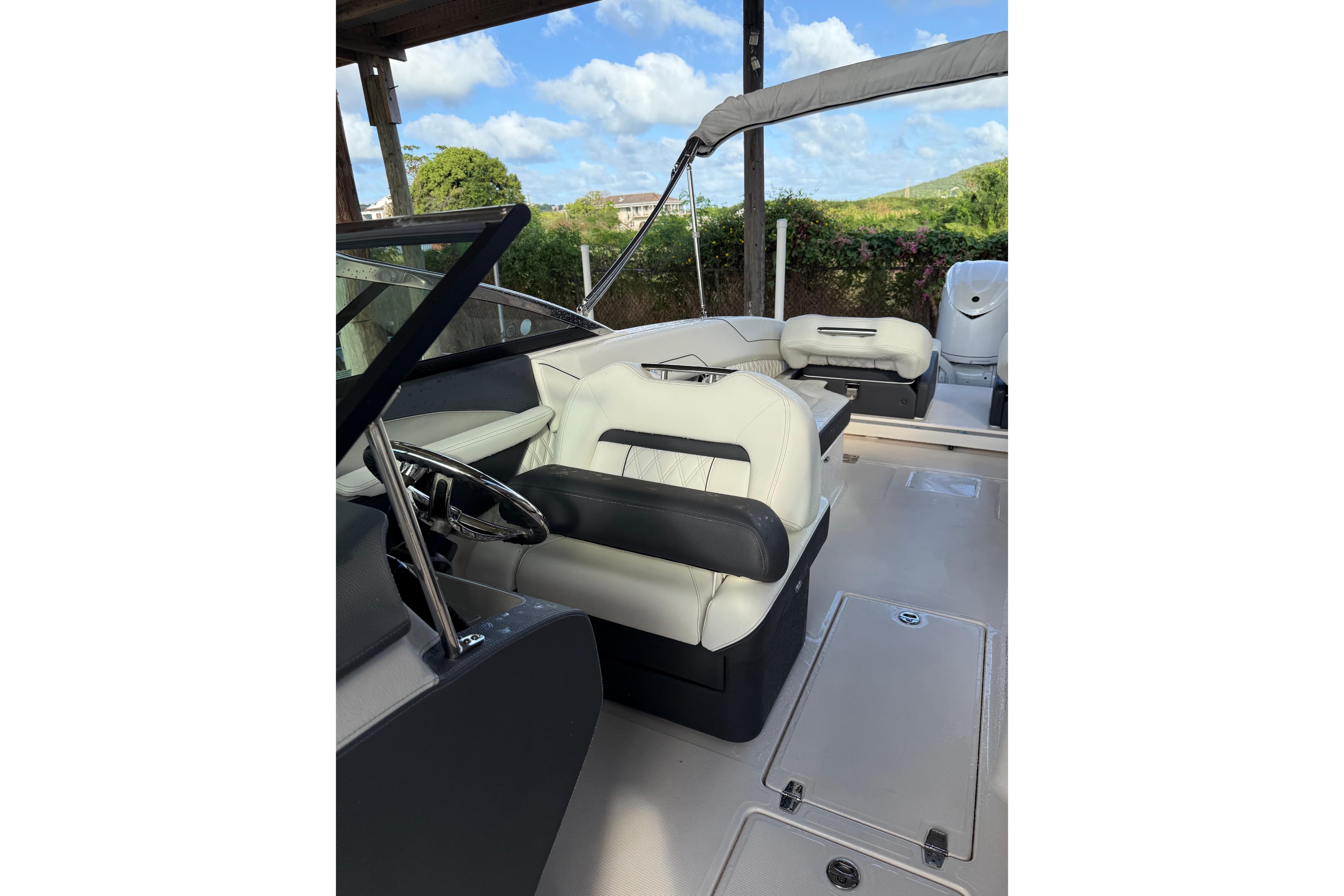 2025 Regal LX6 boat interior with luxurious seating and steering wheel.