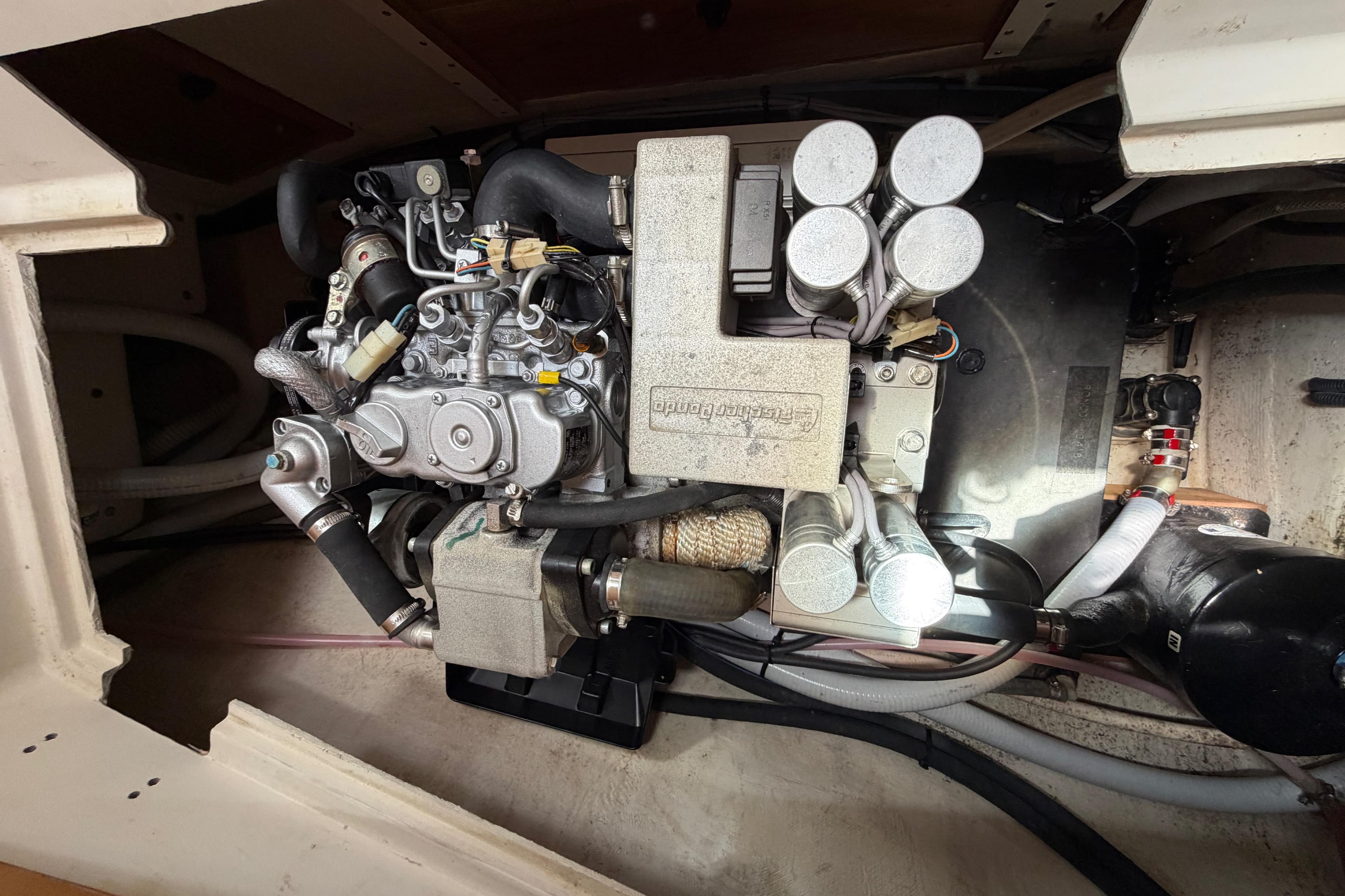 Engine compartment of a 2002 Catalina 470 sailboat, showcasing detailed mechanical components.