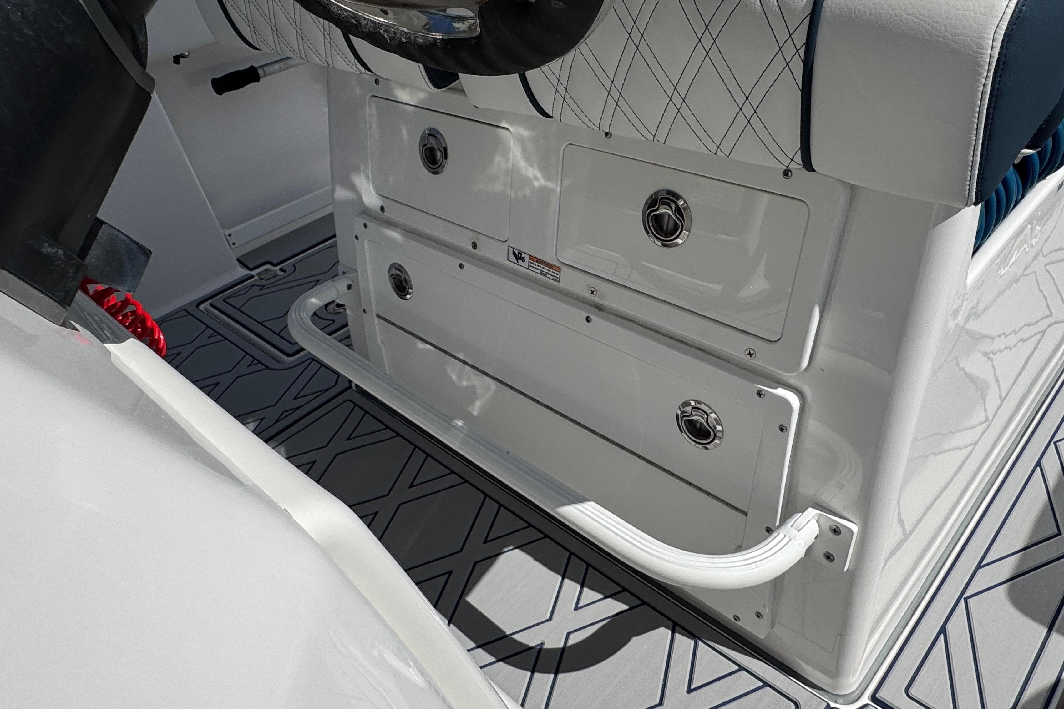 2025 Sea Fox 288 Commander boat interior with storage compartments and seating.