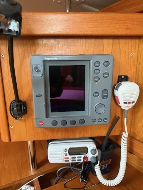 Raymarine navigation system on 2003 Wauquiez Centurion 45s yacht, featuring control panel and radio.